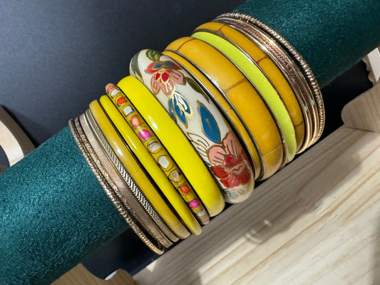 Armful of vintage yellow and gold tones slim and wide tacking boho bangles