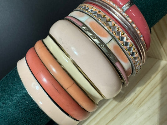 Armful of vintage Orange peach salmon pink and gold tones slim and wide tacking boho bangles