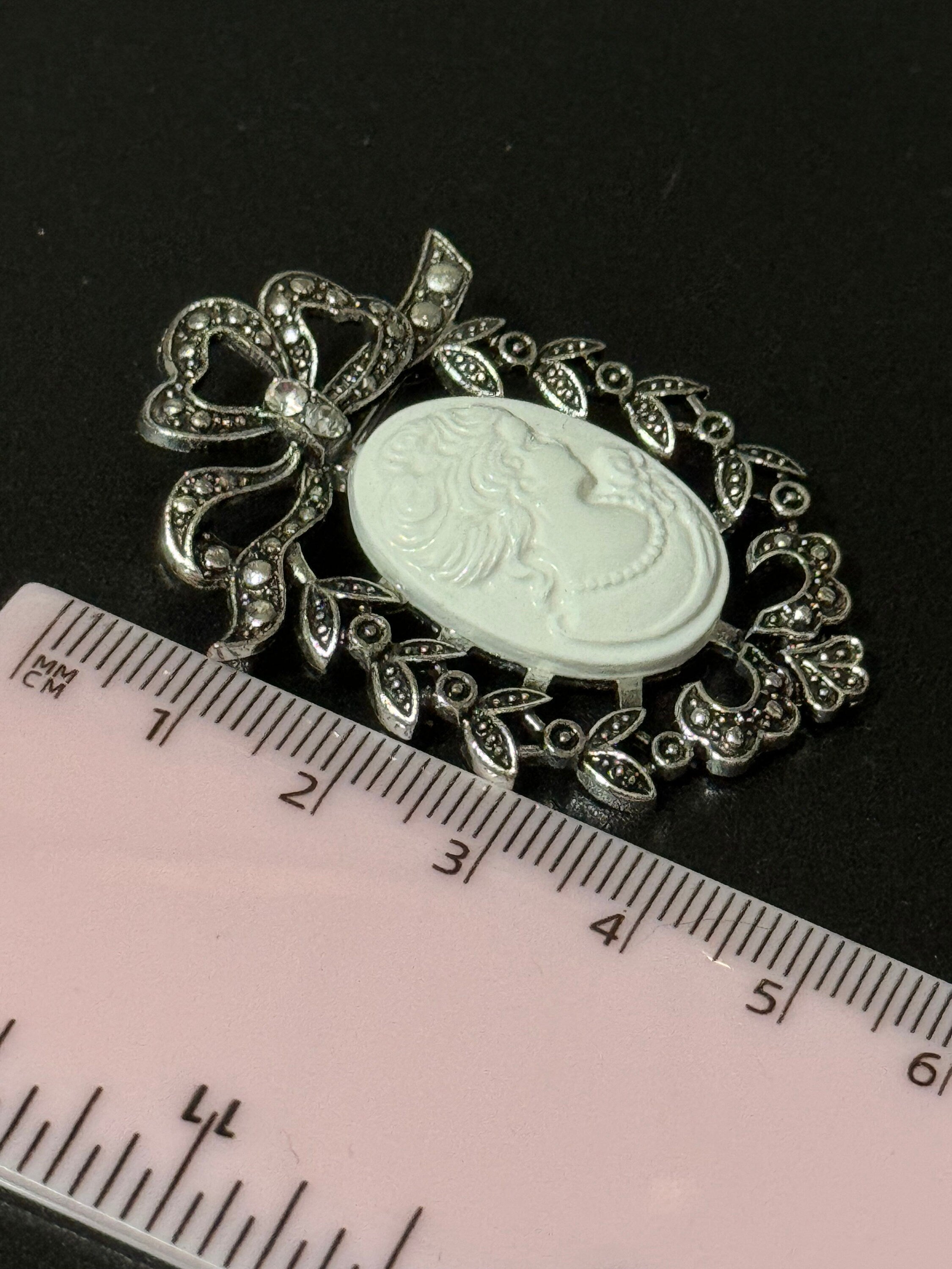 Vintage style handmade white cameo brooch with antique silver tone ornate frame