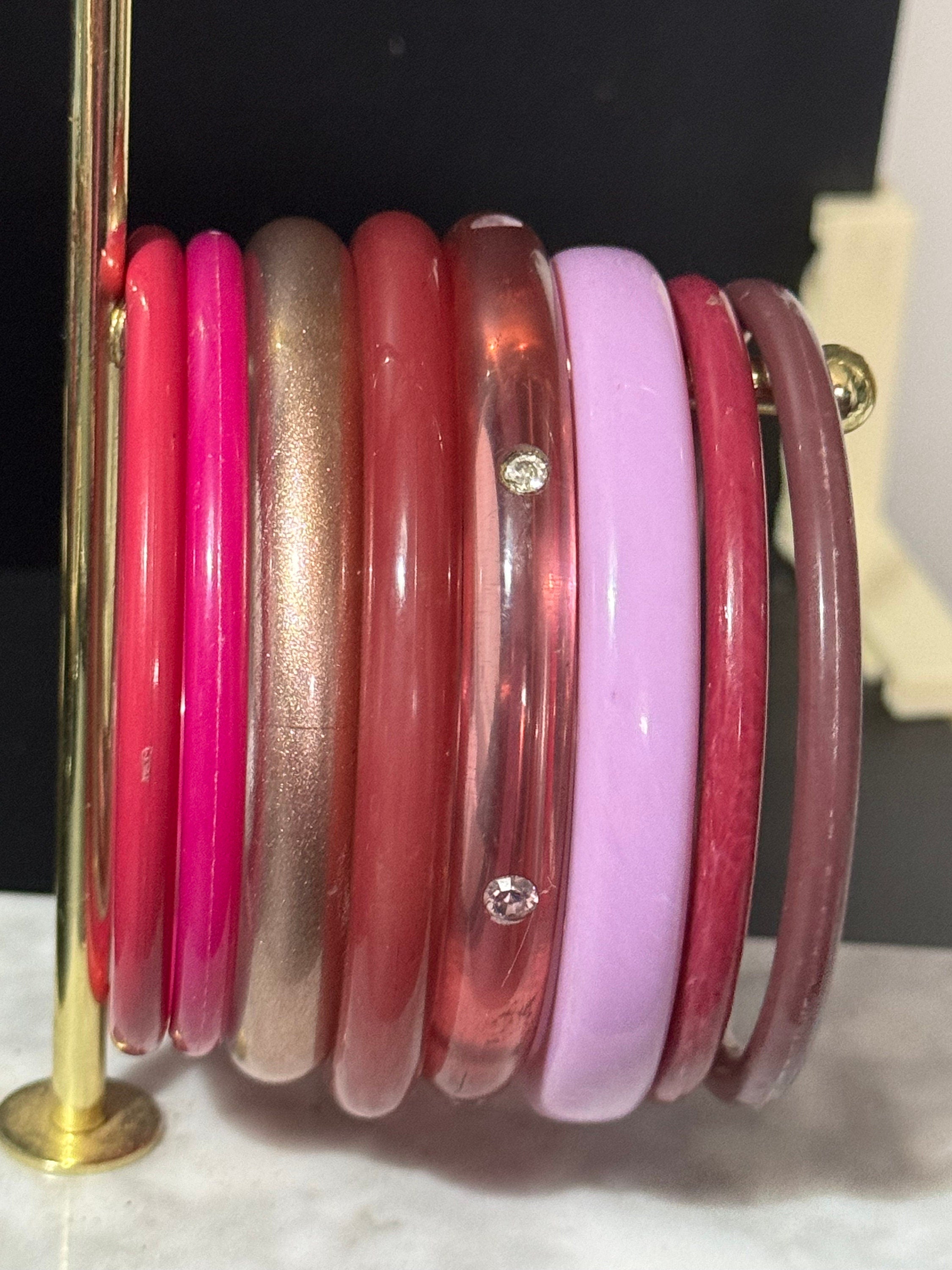 Vintage stack of pink purple plastic bangles retro acrylic bracelets