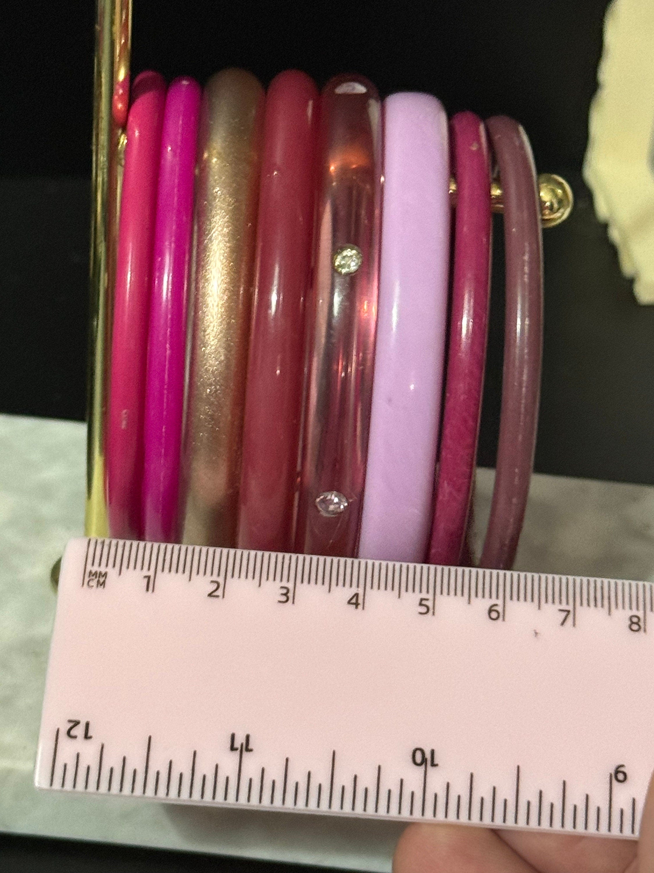 Vintage stack of pink purple plastic bangles retro acrylic bracelets