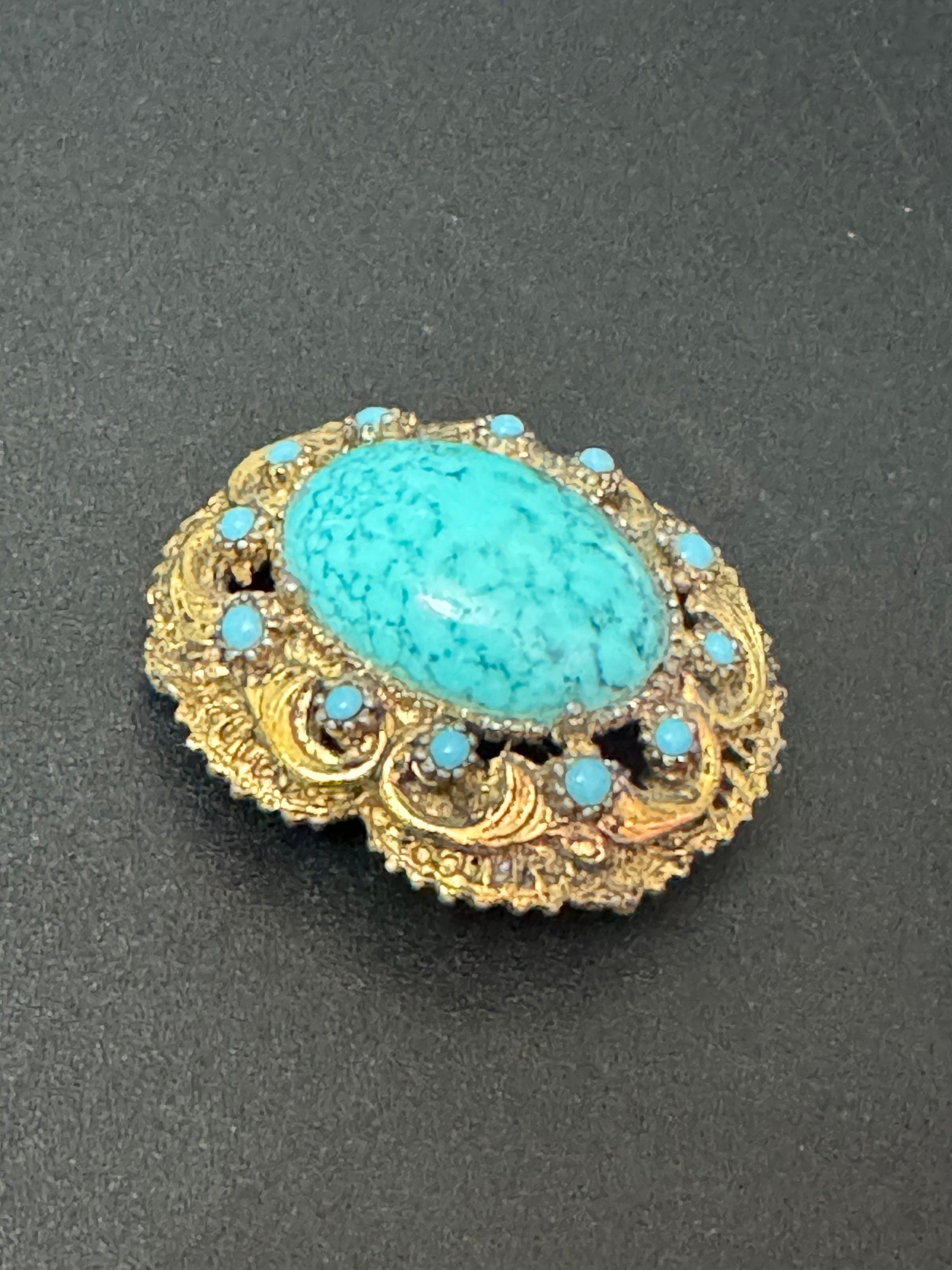 Vintage ornate gold tone turquoise oval cabochon brooch