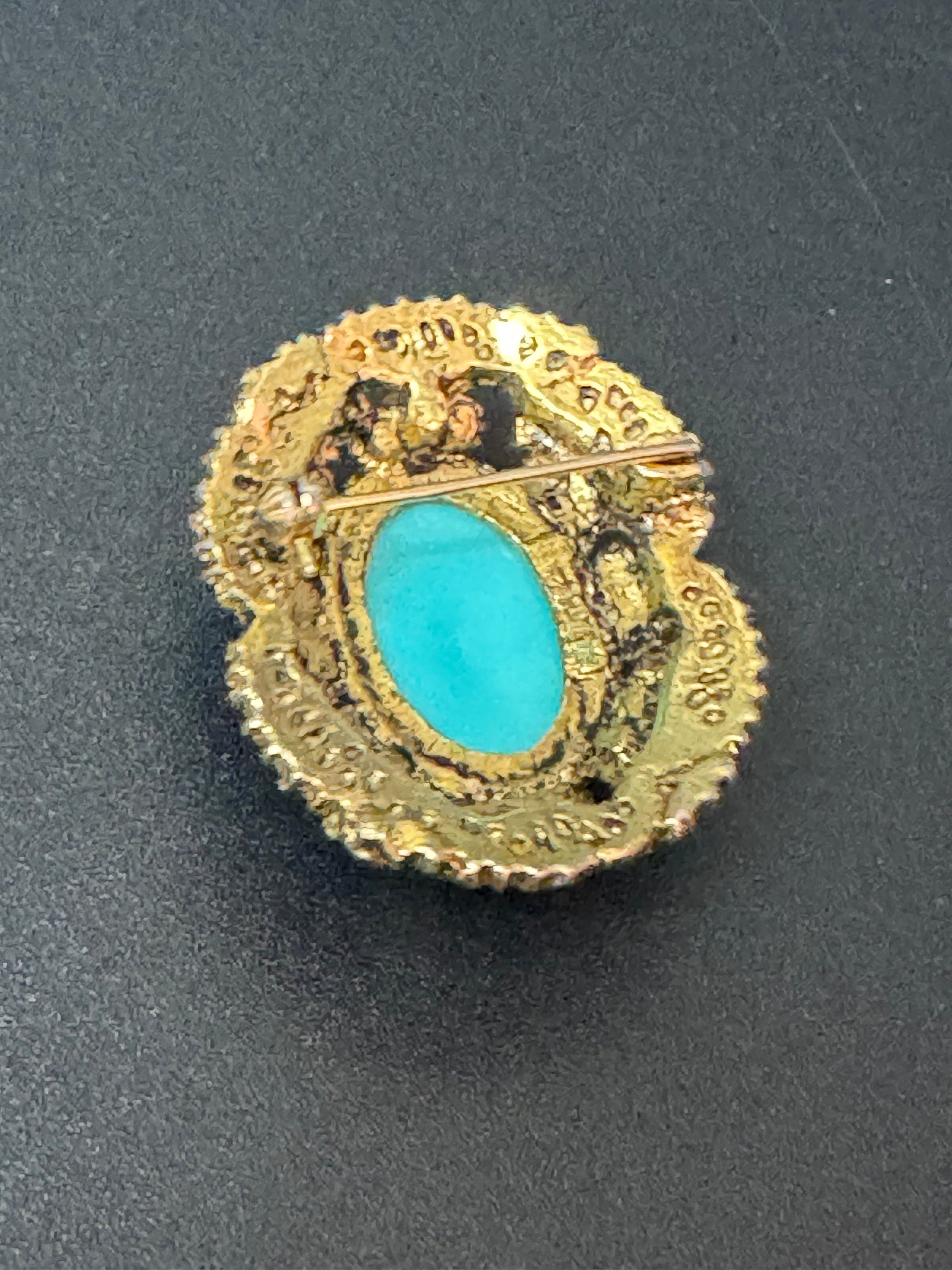 Vintage ornate gold tone turquoise oval cabochon brooch