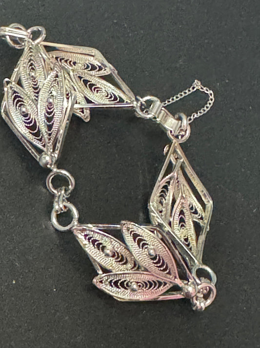 Silver tone fine filigree work panel link bracelet with safety chain