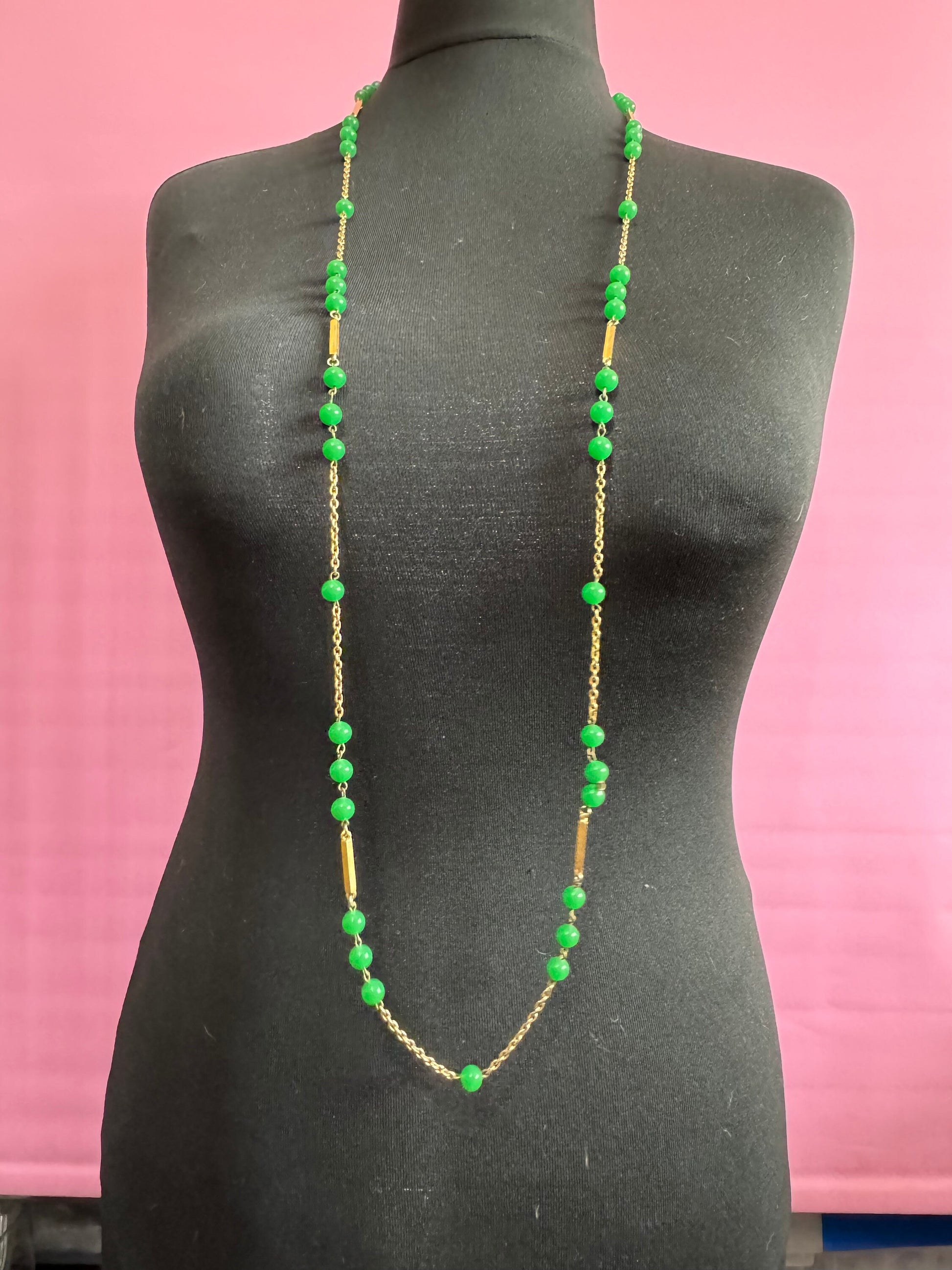 1970s flapper length gold tone metal necklace with bright green jade or glass beads 120cm modernist