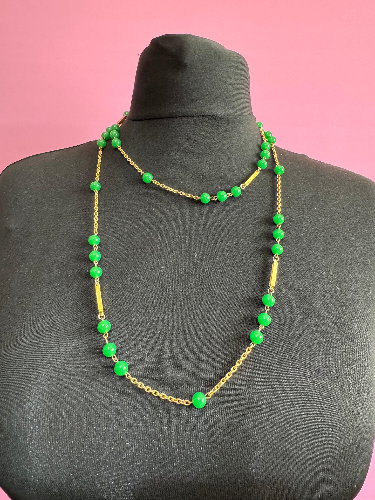 1970s flapper length gold tone metal necklace with bright green jade or glass beads 120cm modernist