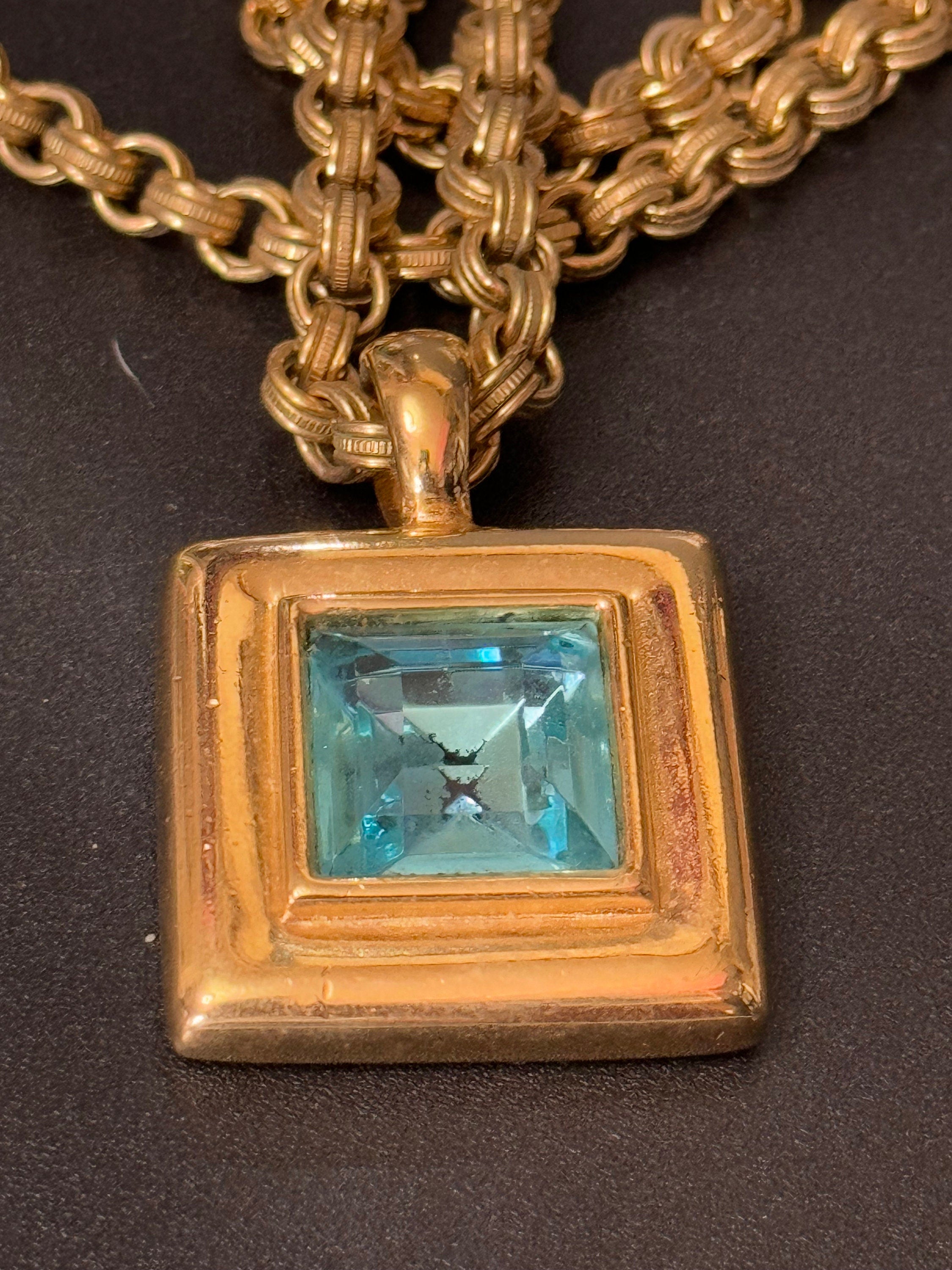 Circa 1980s designer Givenchy Paris New York heavy gold tone square turquoise blue rhinestone pendant necklace on signed 80cm toggle chain