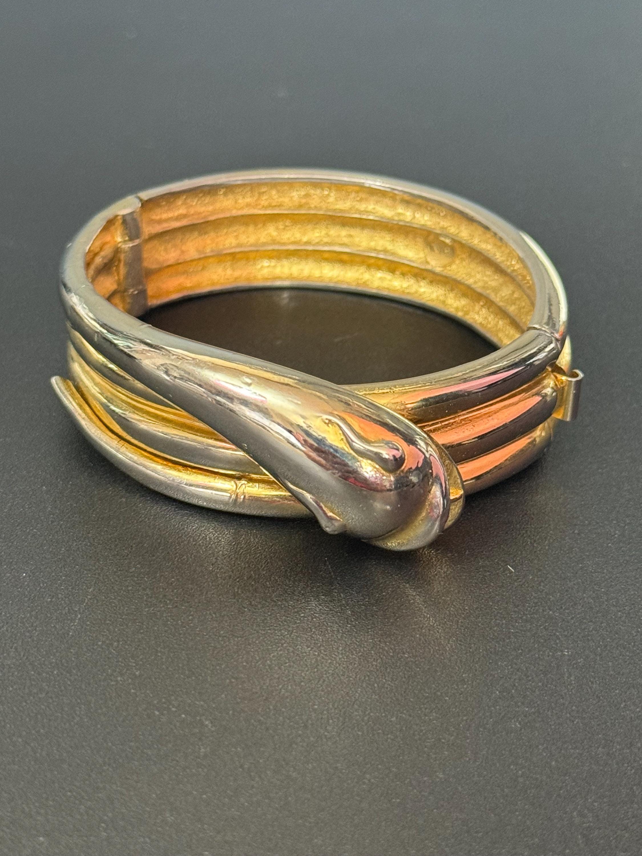 Signed butler and Wilson gold tone snake head clamper bangle cuff bracelet some colour fade