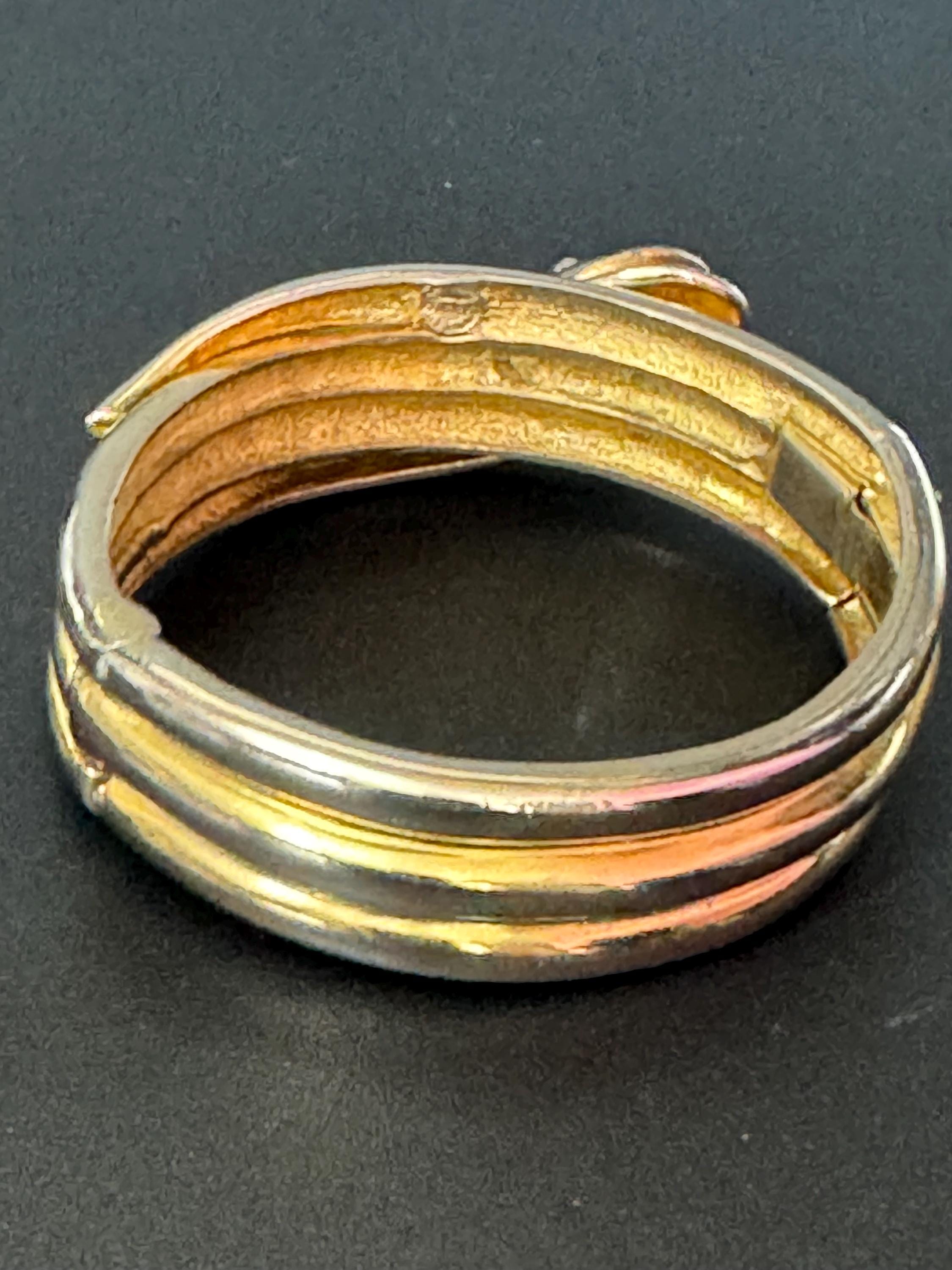 Signed butler and Wilson gold tone snake head clamper bangle cuff bracelet some colour fade