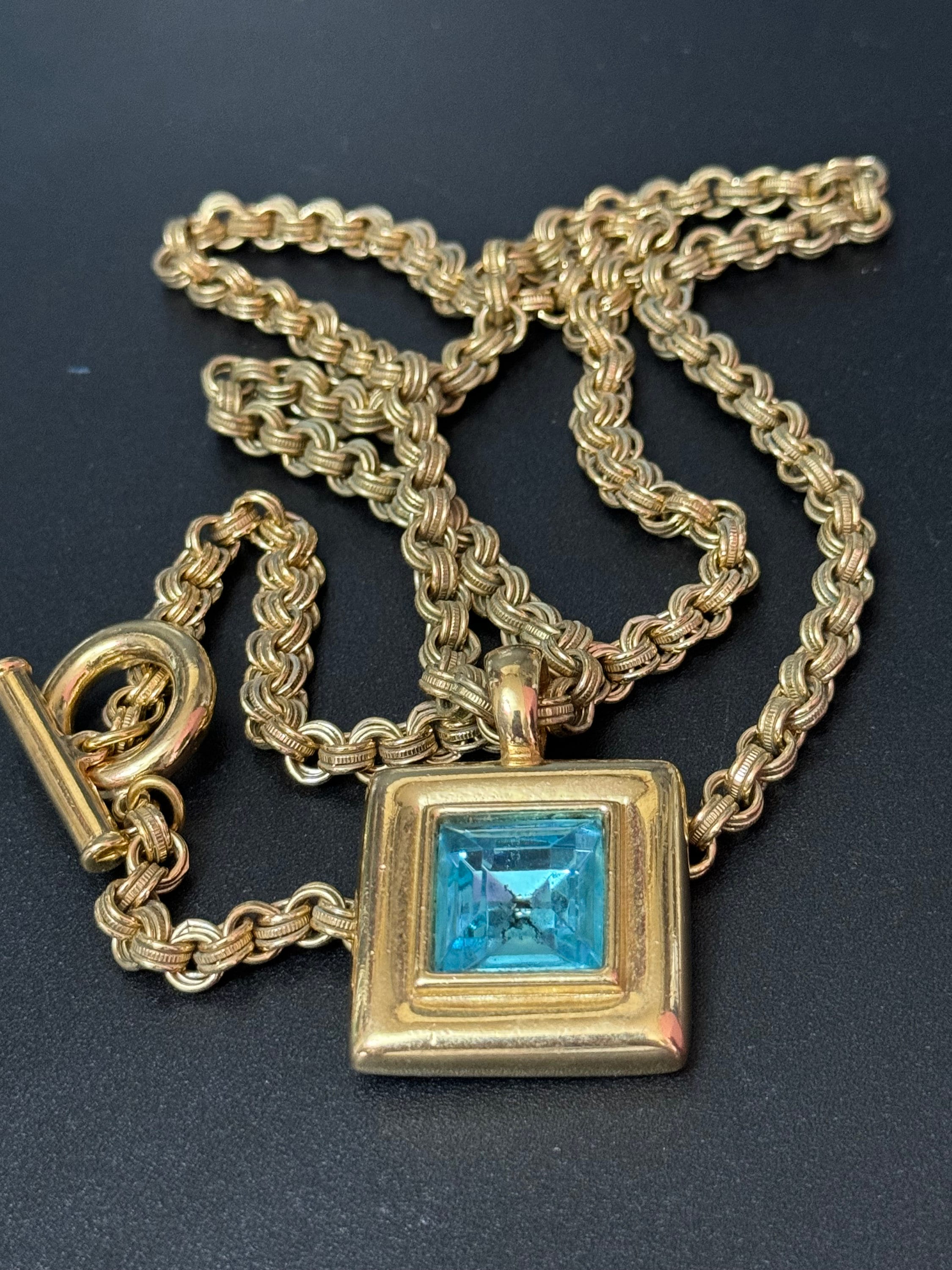 Circa 1980s designer Givenchy Paris New York heavy gold tone square turquoise blue rhinestone pendant necklace on signed 80cm toggle chain