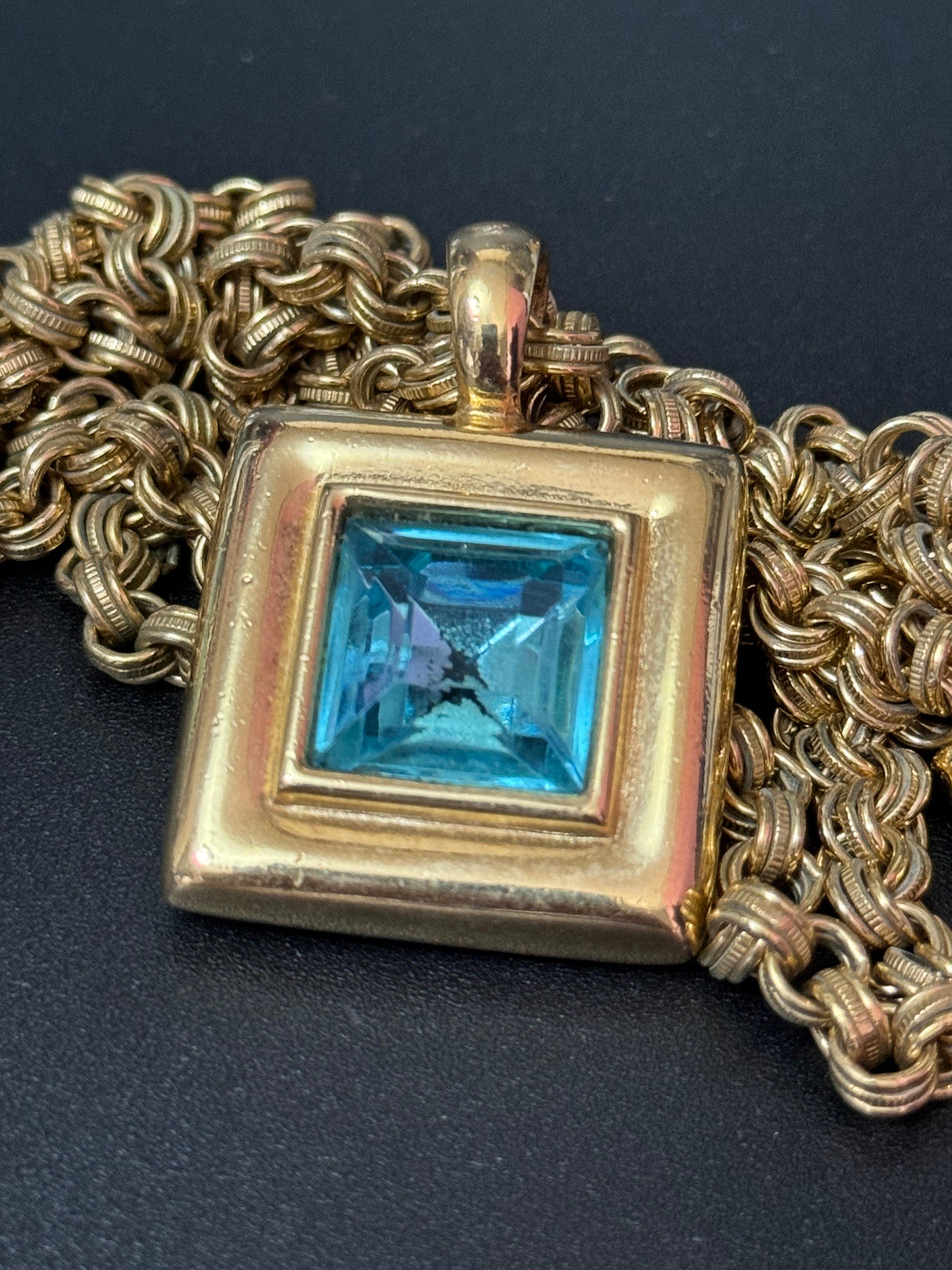 Circa 1980s designer Givenchy Paris New York heavy gold tone square turquoise blue rhinestone pendant necklace on signed 80cm toggle chain