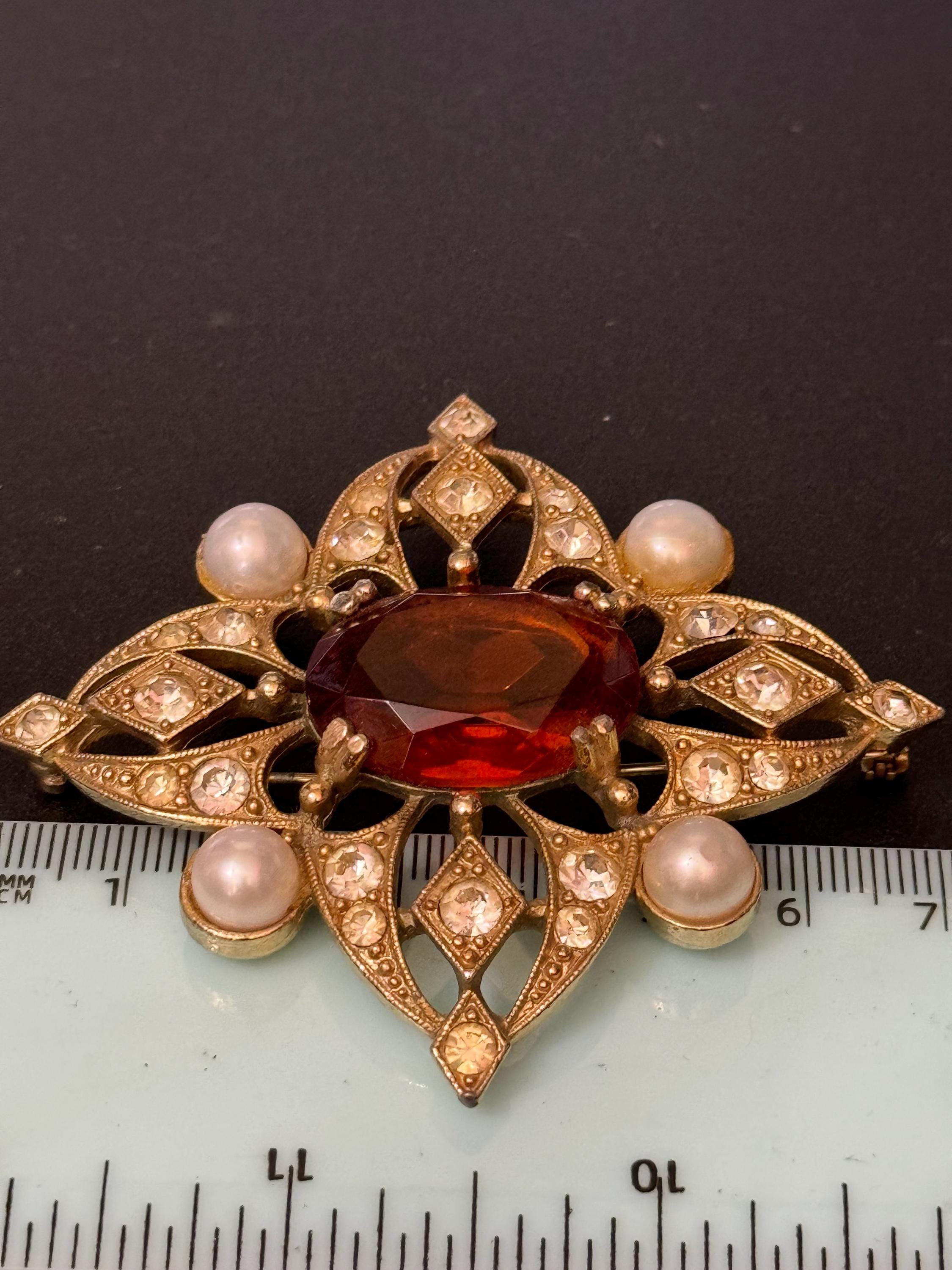 Signed Sarah Coventry Large 7cm gold tone faux pearl brooch with orange brown glass rhinestone