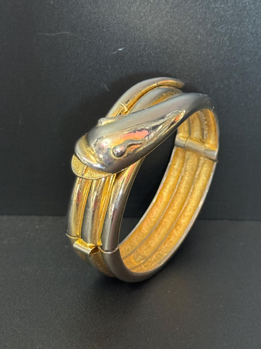 Signed butler and Wilson gold tone snake head clamper bangle cuff bracelet some colour fade