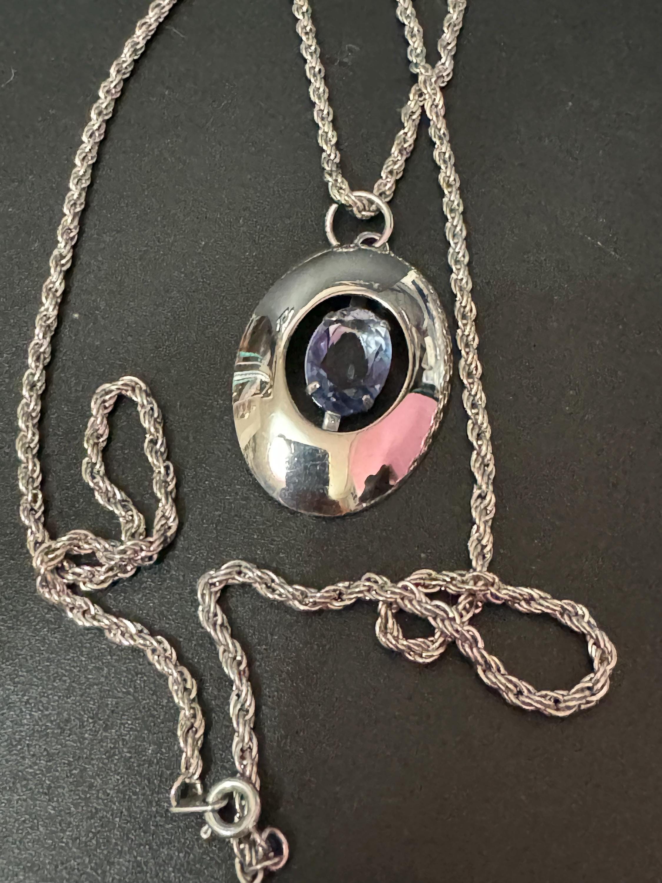 Vintage Modernist silver tone stainless Steel pendant necklace with central amethyst purple rhinestone Mid Century 1960s 1970s