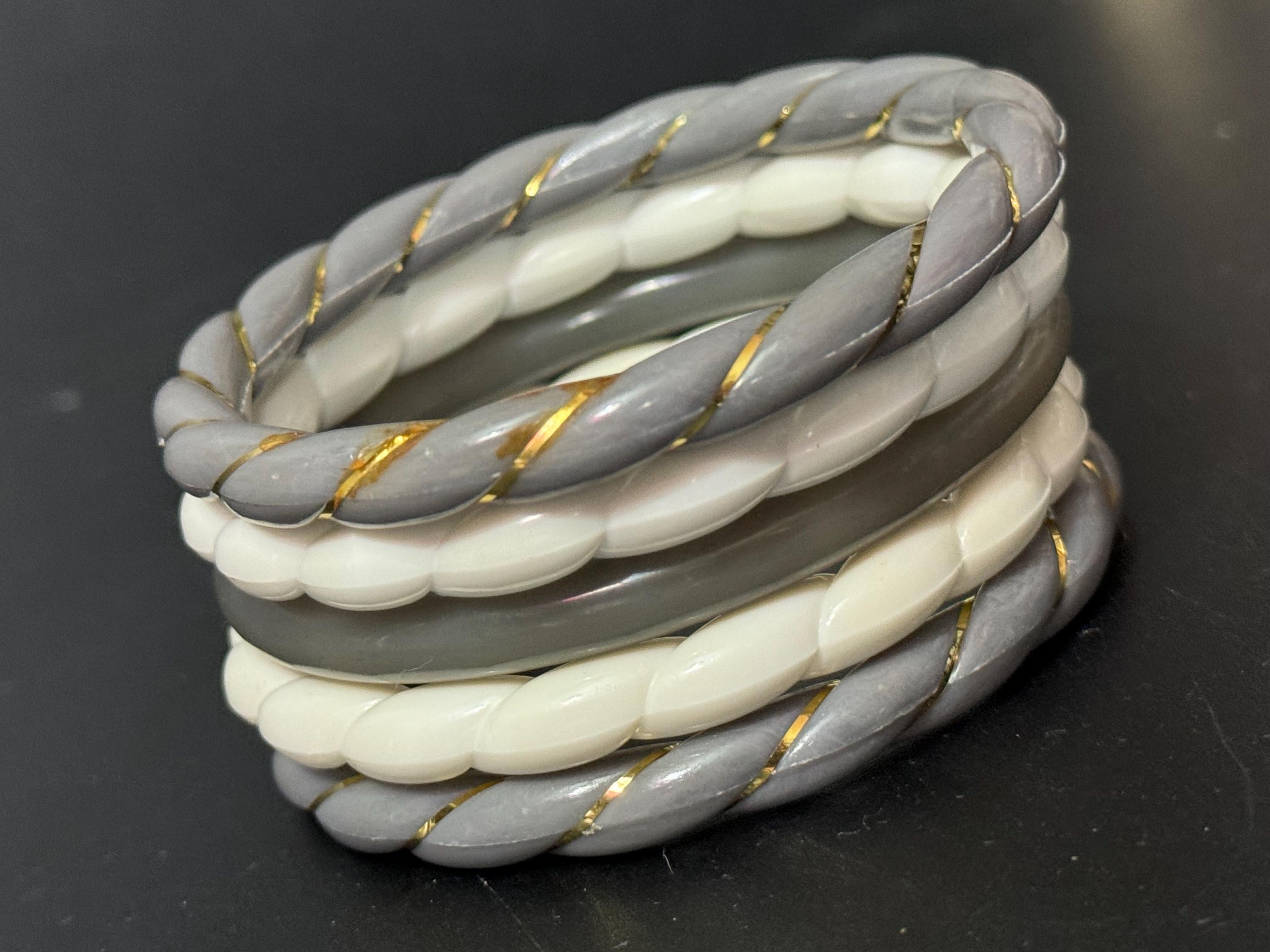 White and grey stack of vintage twisted plastic bangles