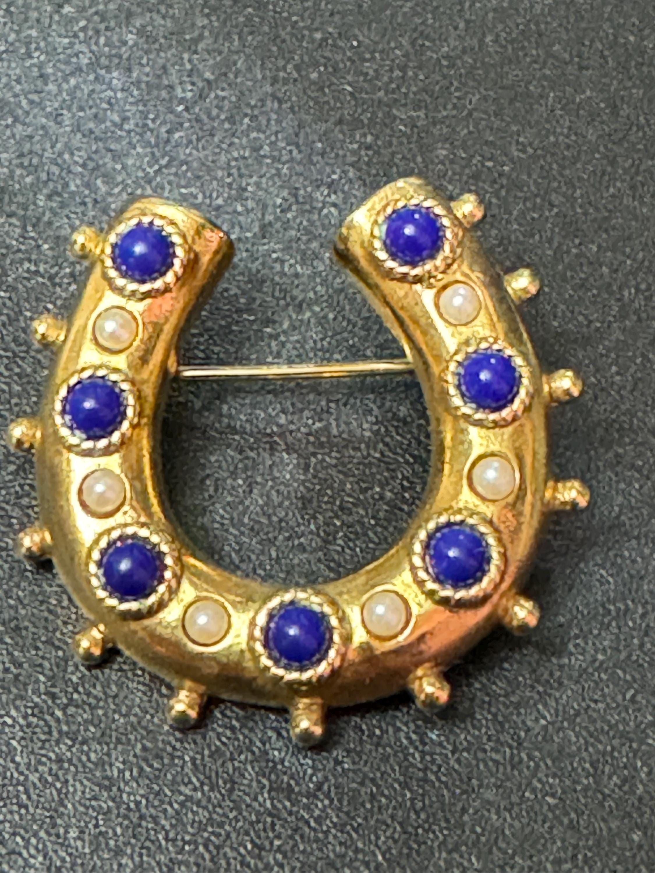 Victorian style gold plated horseshoe brooch with seed pearls and blue gemstones roll clasp