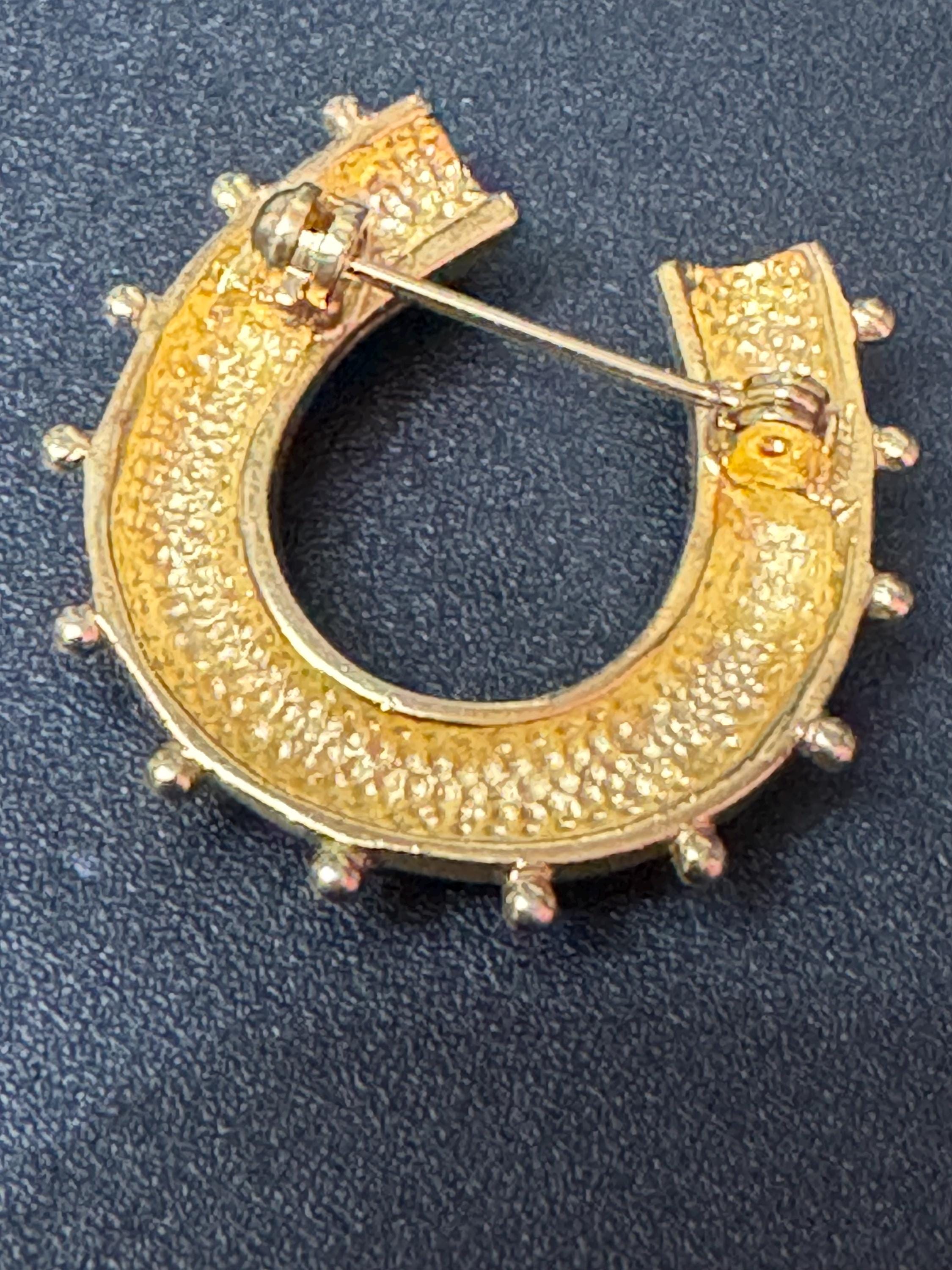 Victorian style gold plated horseshoe brooch with seed pearls and blue gemstones roll clasp