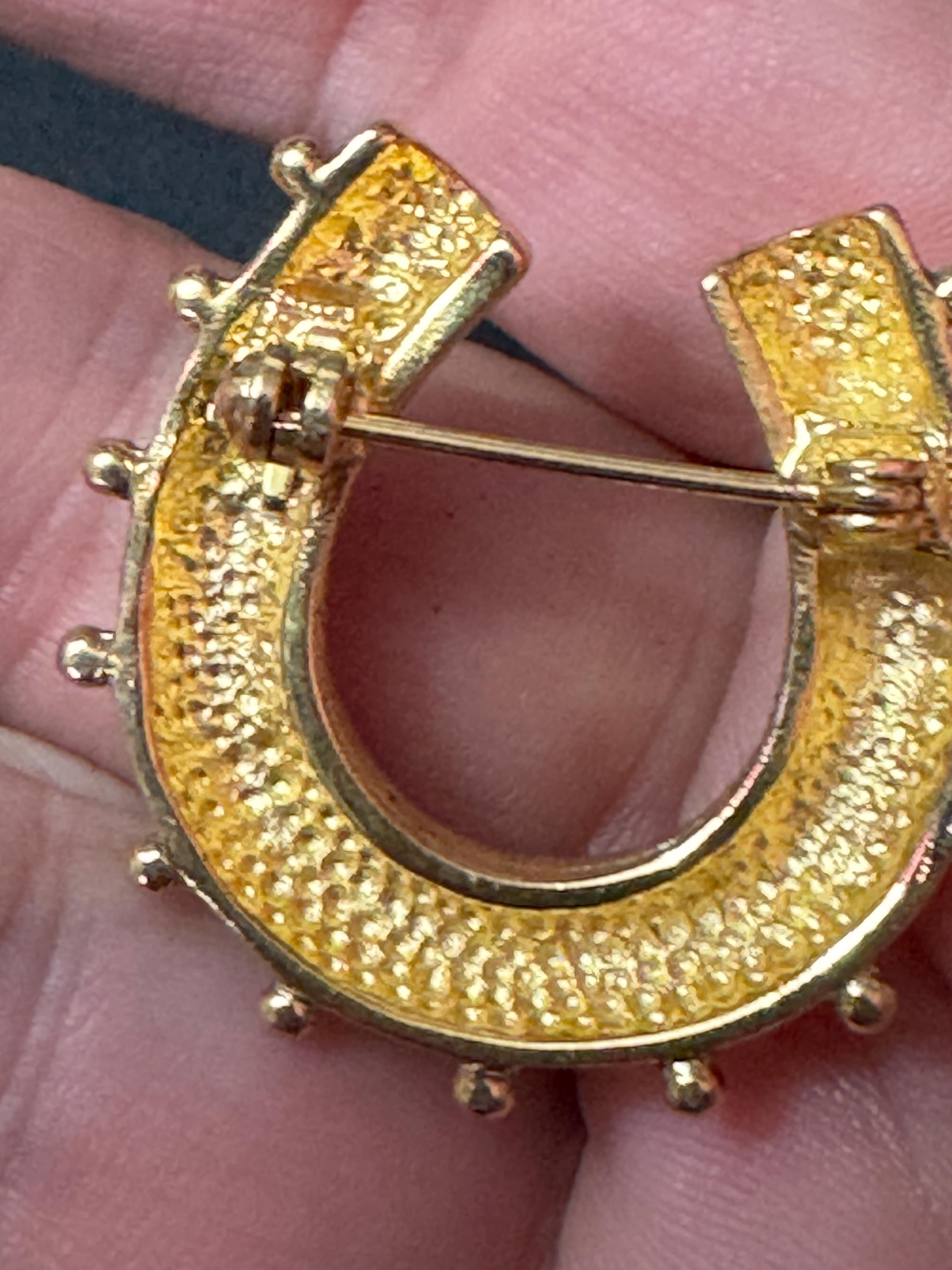 Victorian style gold plated horseshoe brooch with seed pearls and blue gemstones roll clasp