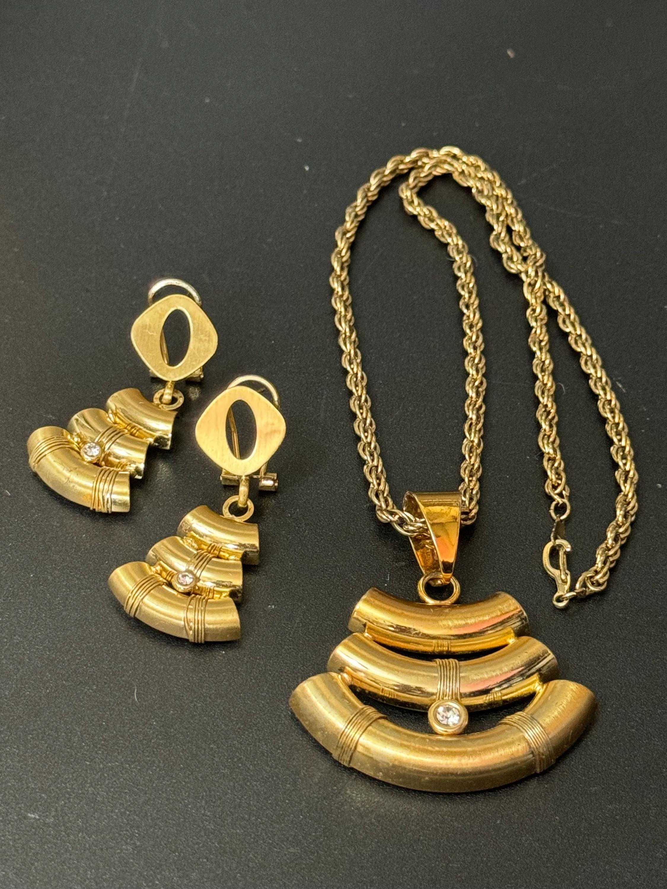 Vintage gold tube metal pendant necklace and pierced drop earrings jewellery set with clear crystal detail