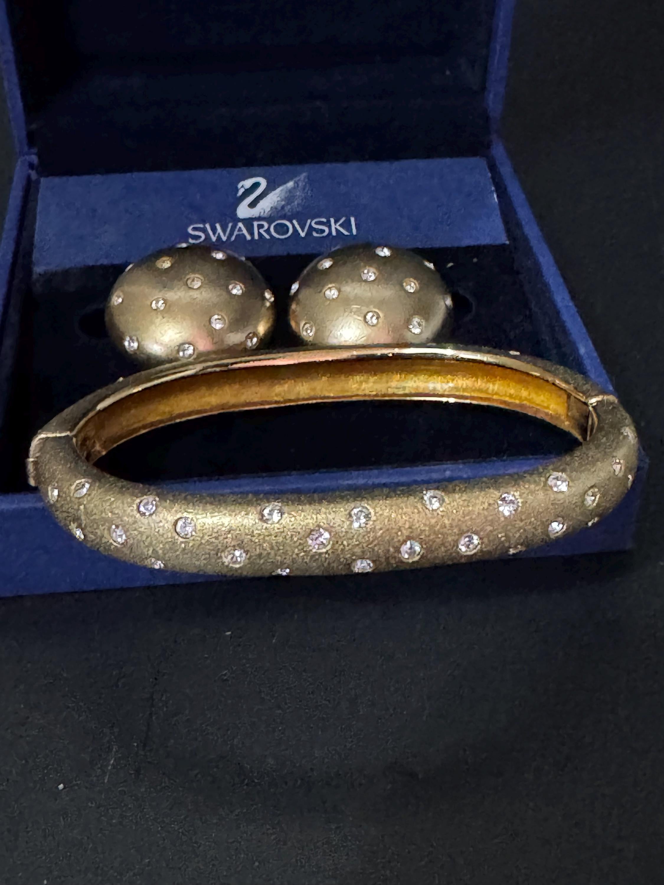 Jewellery set signed swan Swarovski crystal pave set Matt gold plated clamper bangle and matching button clip on earrings