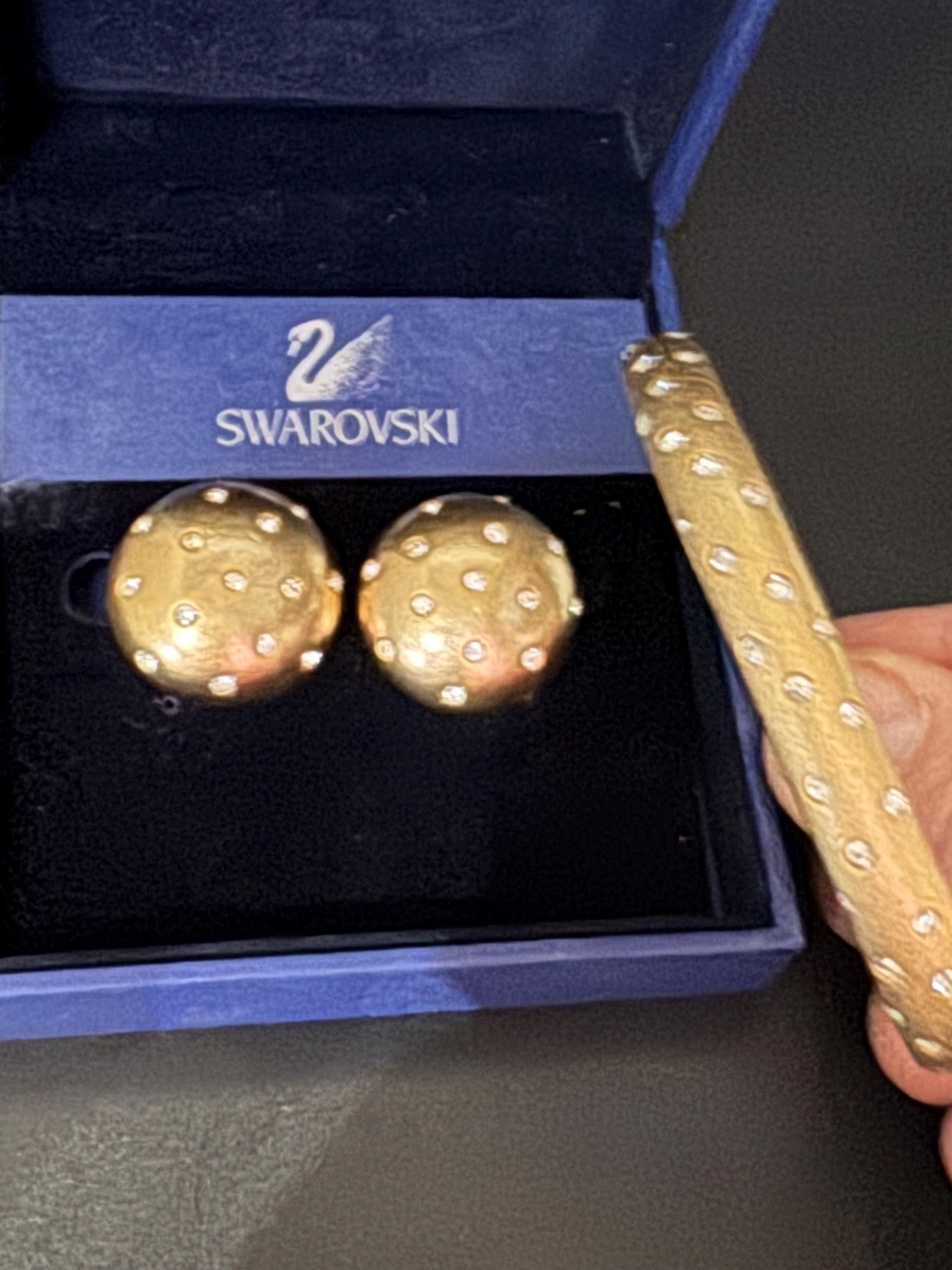 Jewellery set signed swan Swarovski crystal pave set Matt gold plated clamper bangle and matching button clip on earrings