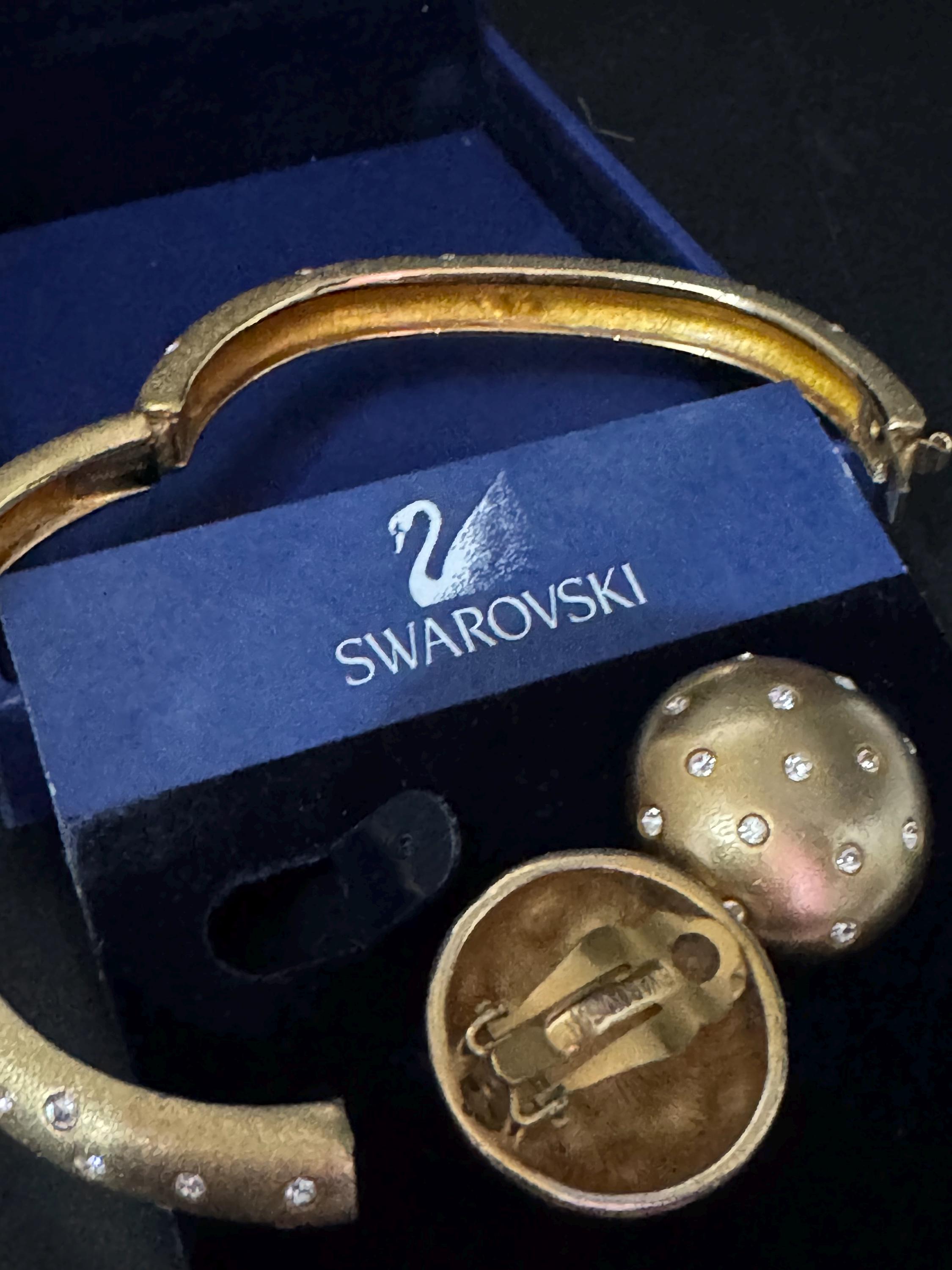 Jewellery set signed swan Swarovski crystal pave set Matt gold plated clamper bangle and matching button clip on earrings