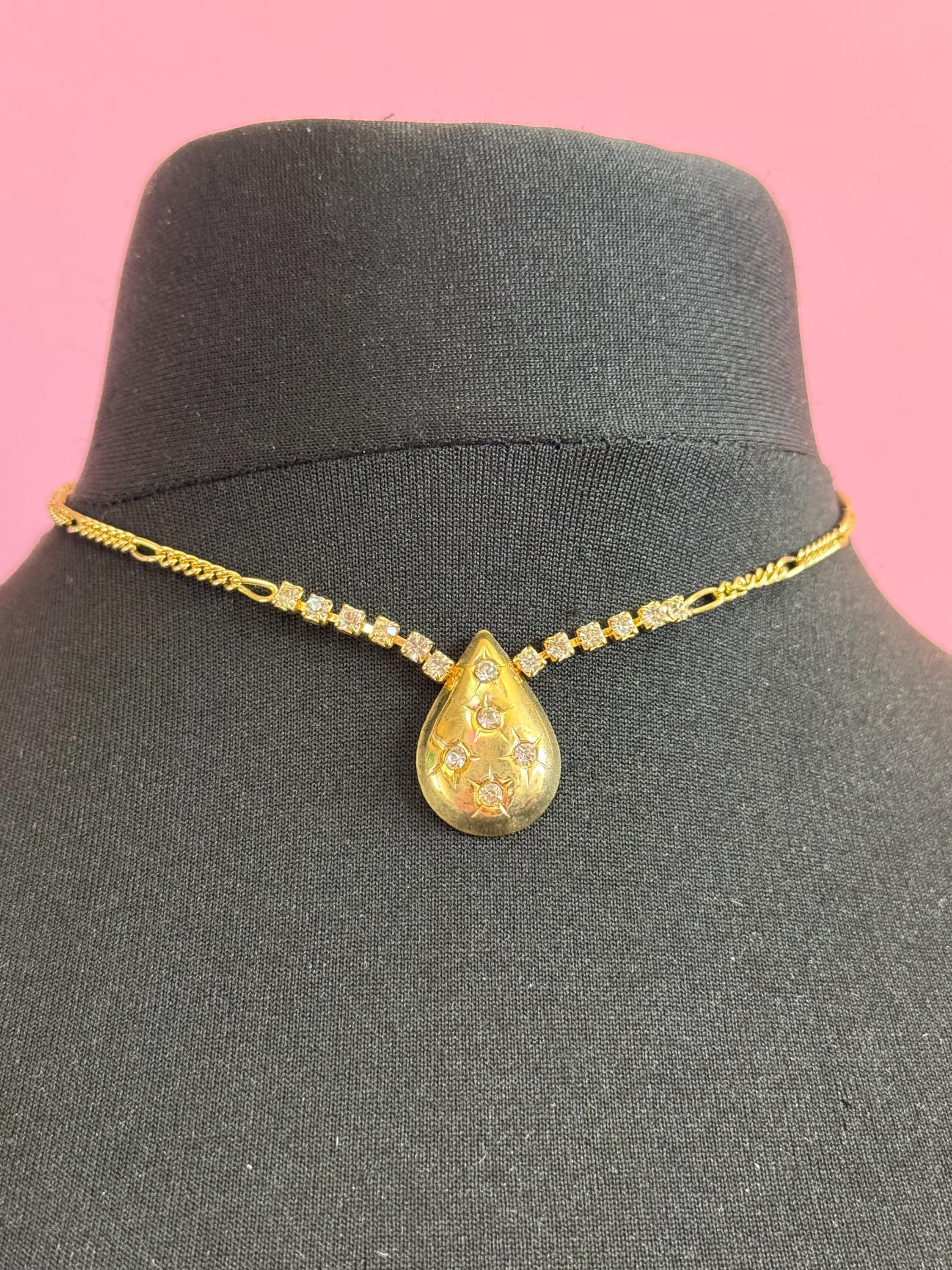 Vintage 1990s gold tone diamanté figaro chain link necklace with star cut rhinestone teardrop pendant