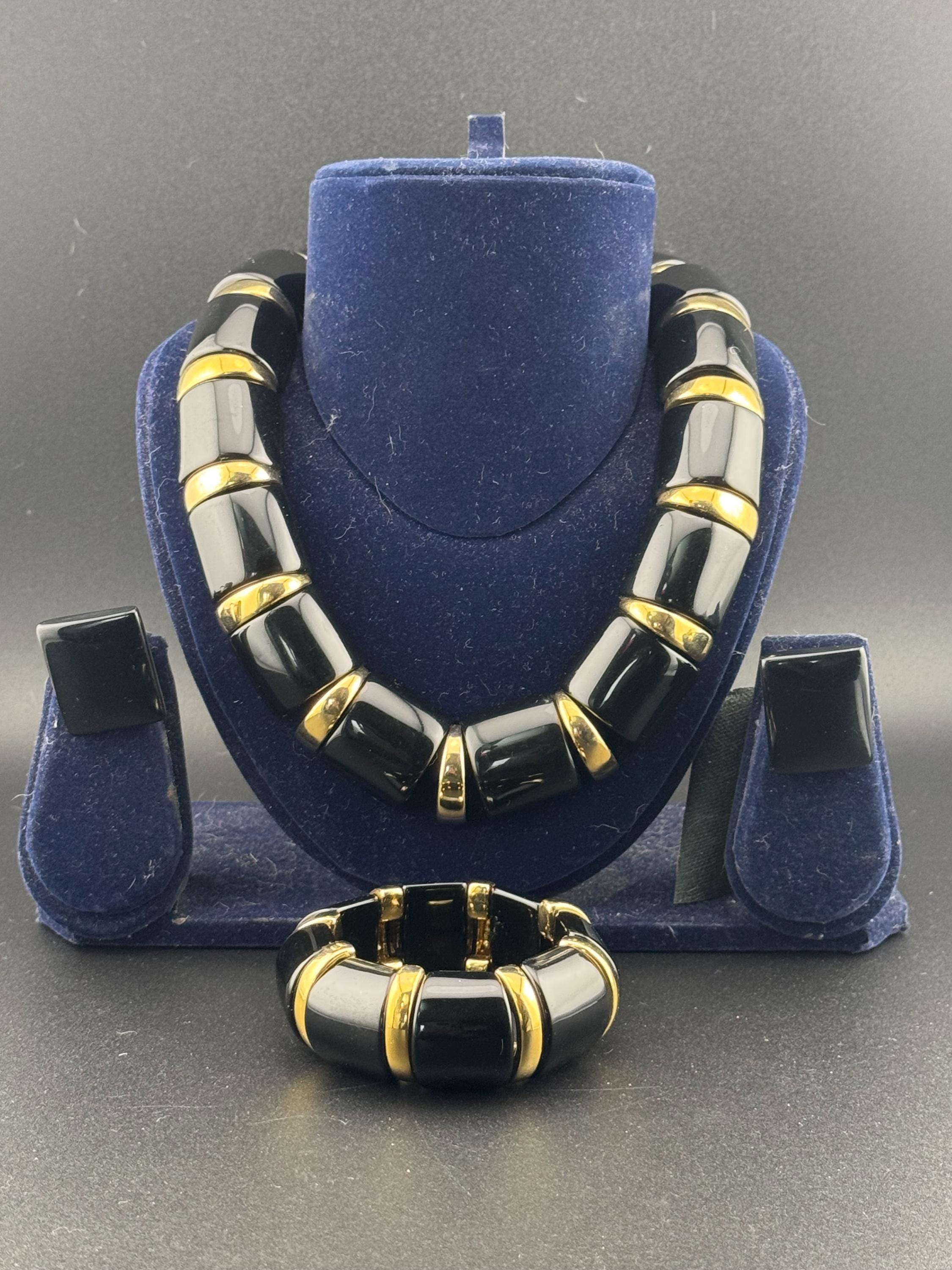 Signed NAPIER Vintage black glossy lucite gold tone panel collar necklace , stretch bracelet and clip on earrings jewellery set