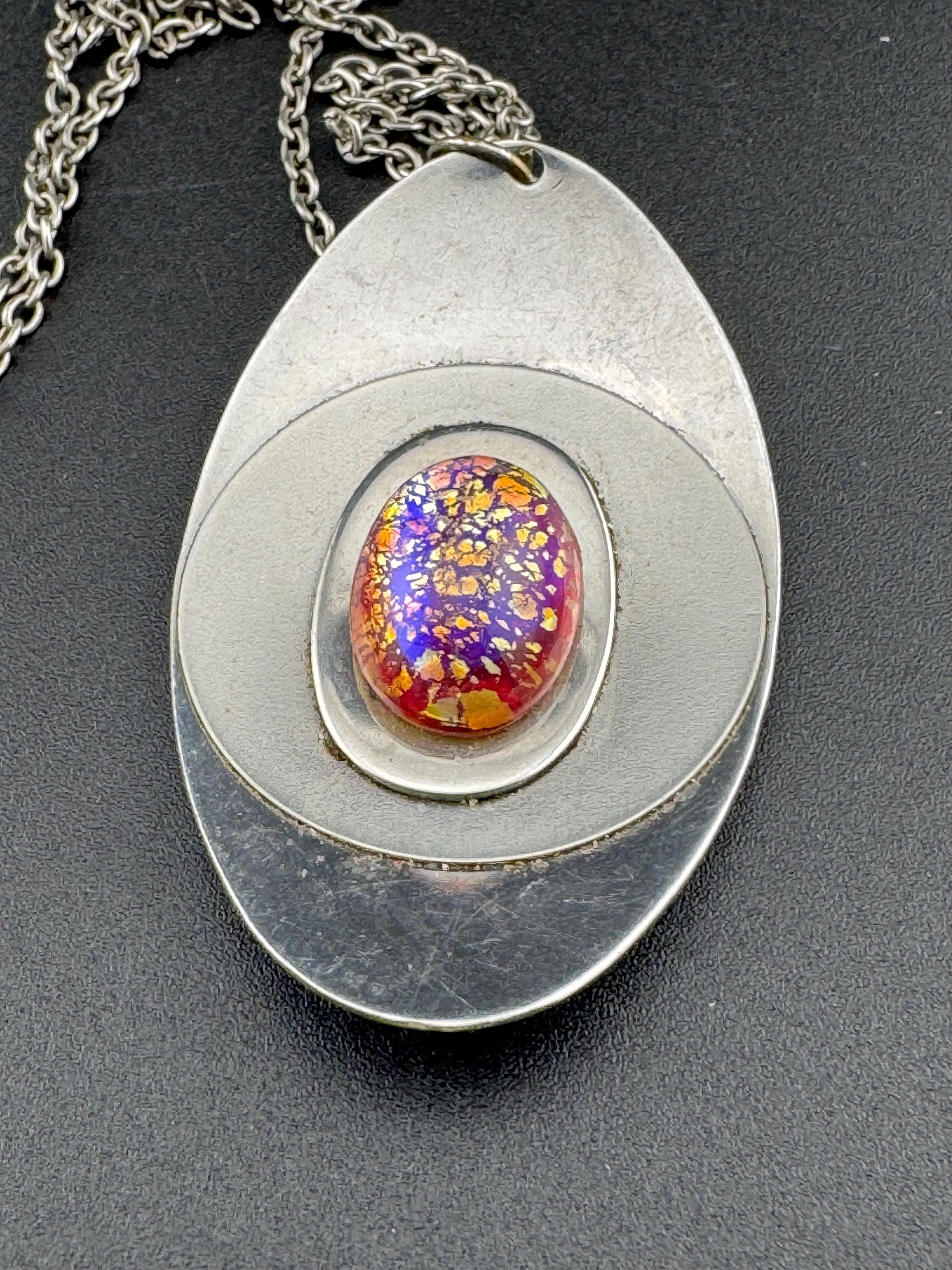 Vintage Modernist silver tone stainless steel pendant necklace and chain set with central purple crackle glass cabochon 1970s