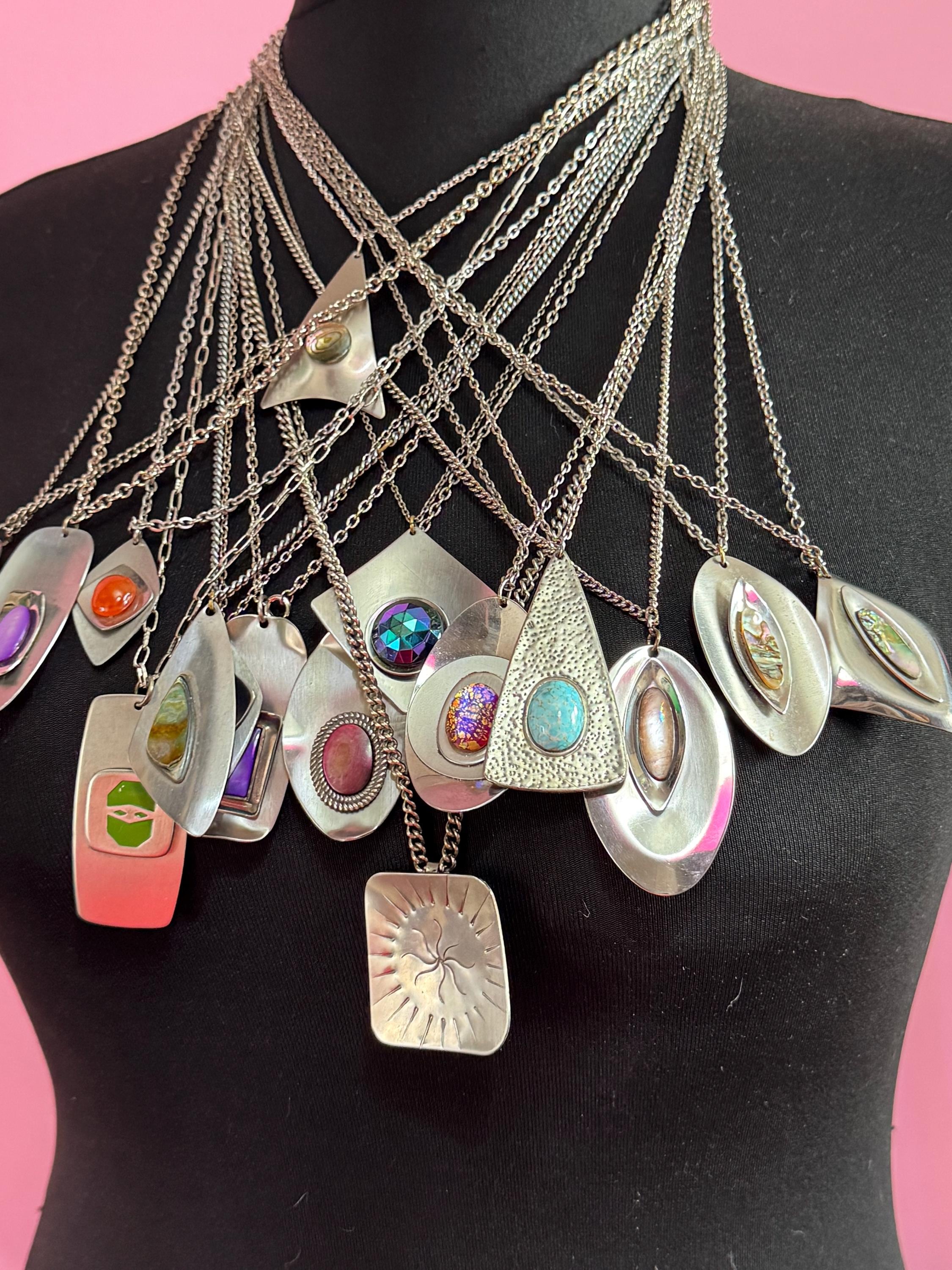 Vintage Modernist silver tone stainless steel pendant necklace and chain set with central domed rainbow glass cabochon 1970s