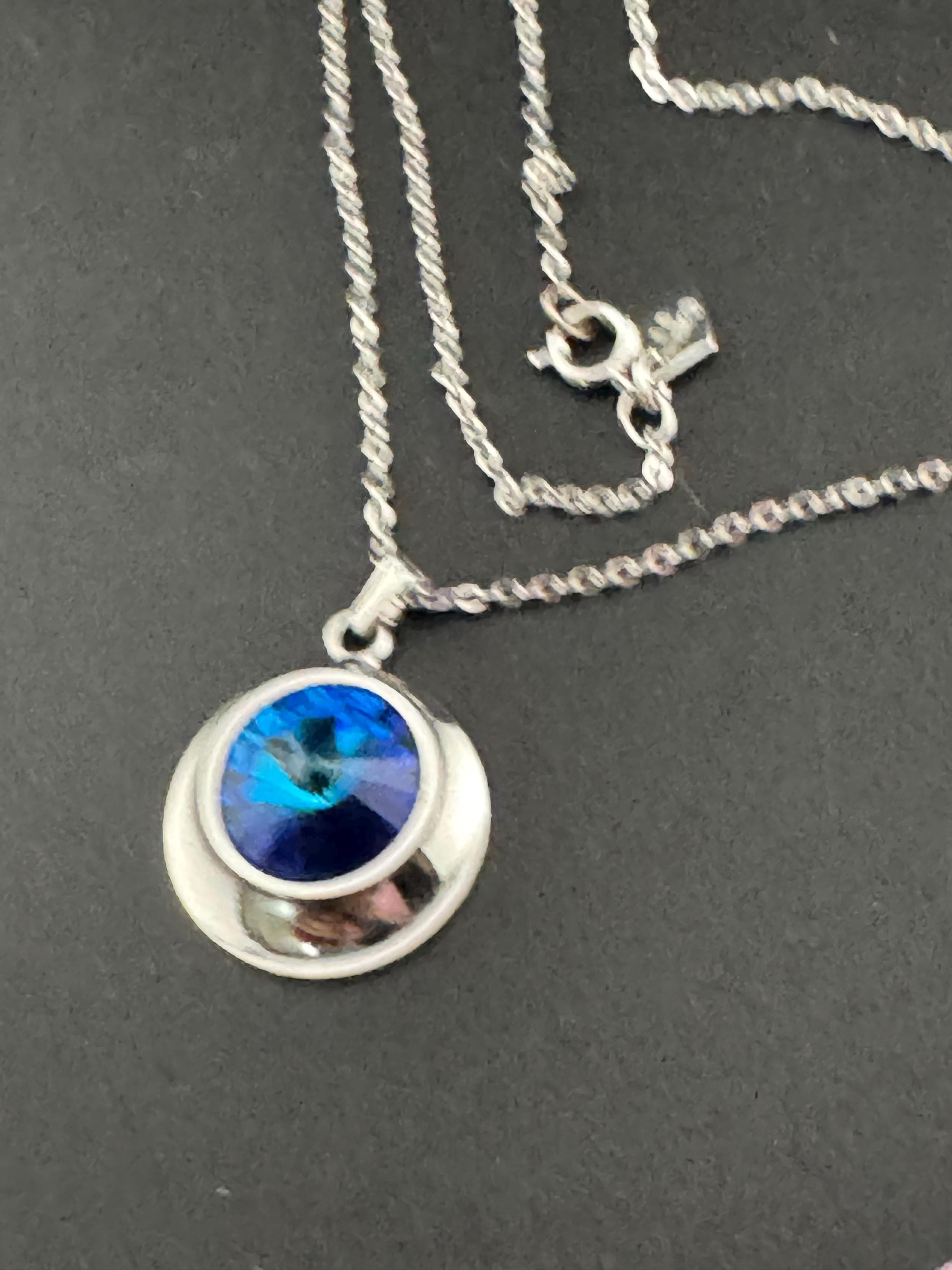 signed Sarah Coventry blue liquid light design silver tone blue Rivoli crystal 1970s pendant drop necklace, vintage designer