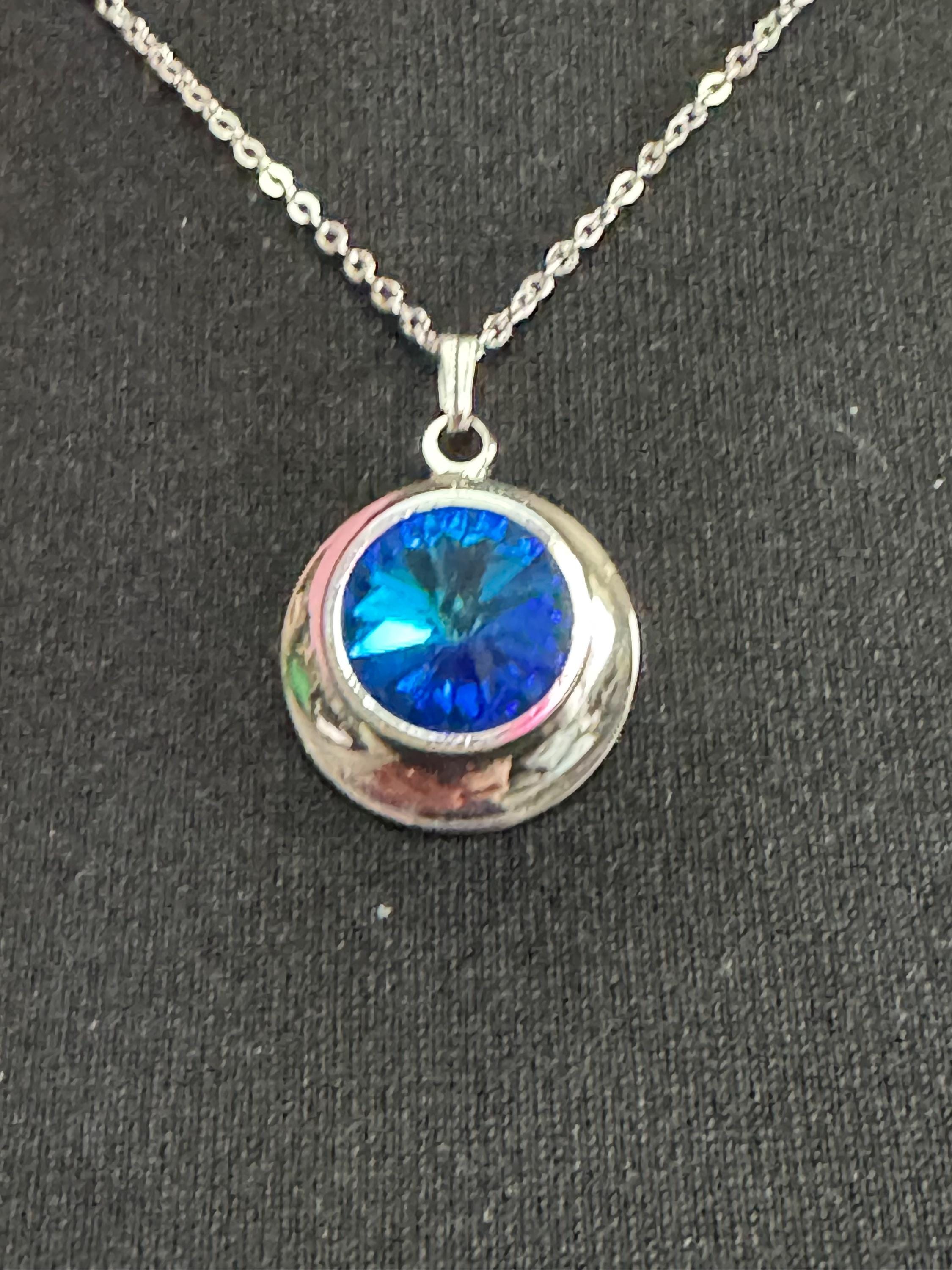 signed Sarah Coventry blue liquid light design silver tone blue Rivoli crystal 1970s pendant drop necklace, vintage designer