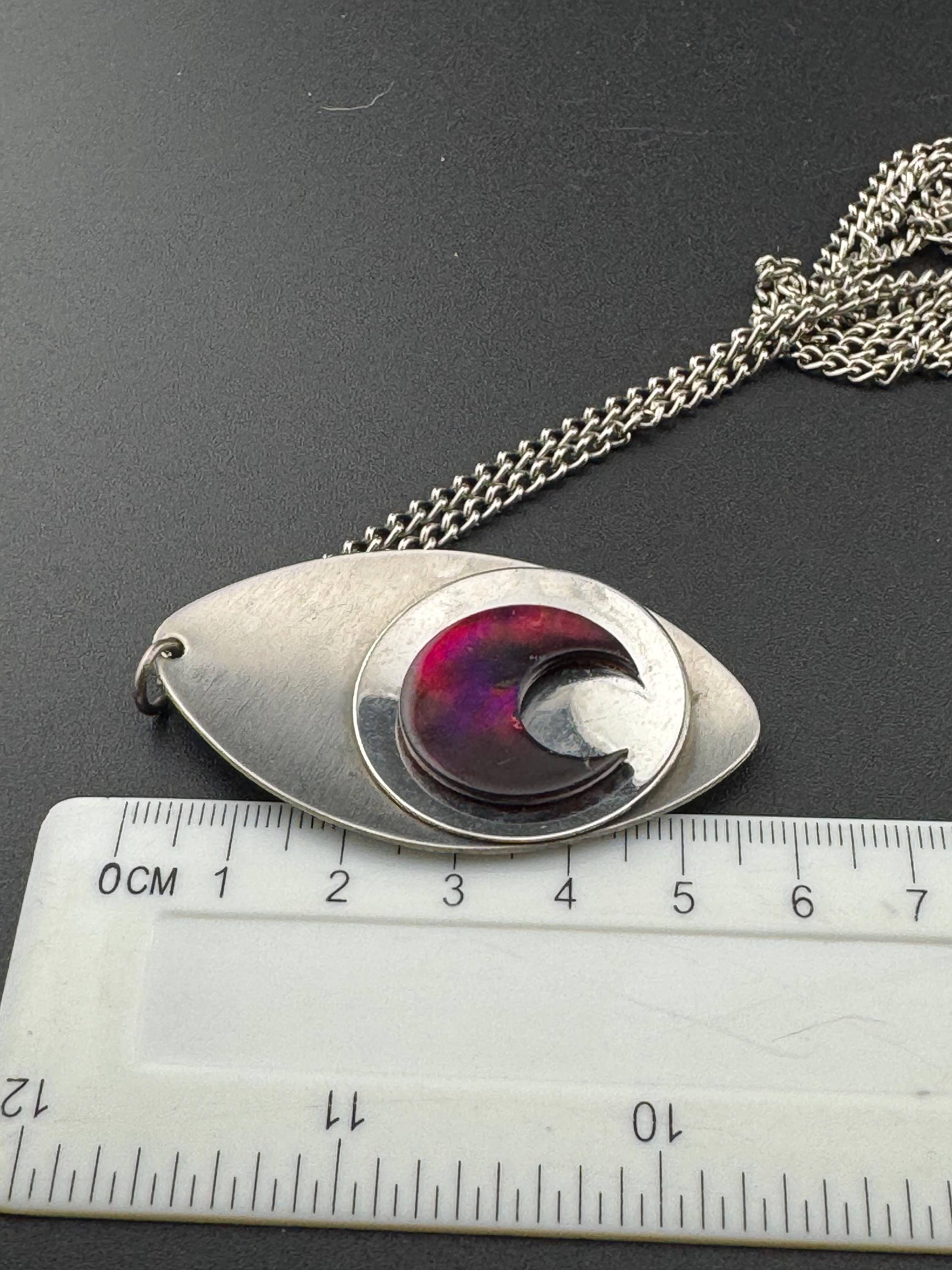 Vintage Modernist silver tone stainless steel pendant necklace and chain set with central purple glass crescent moon cabochon 1970s