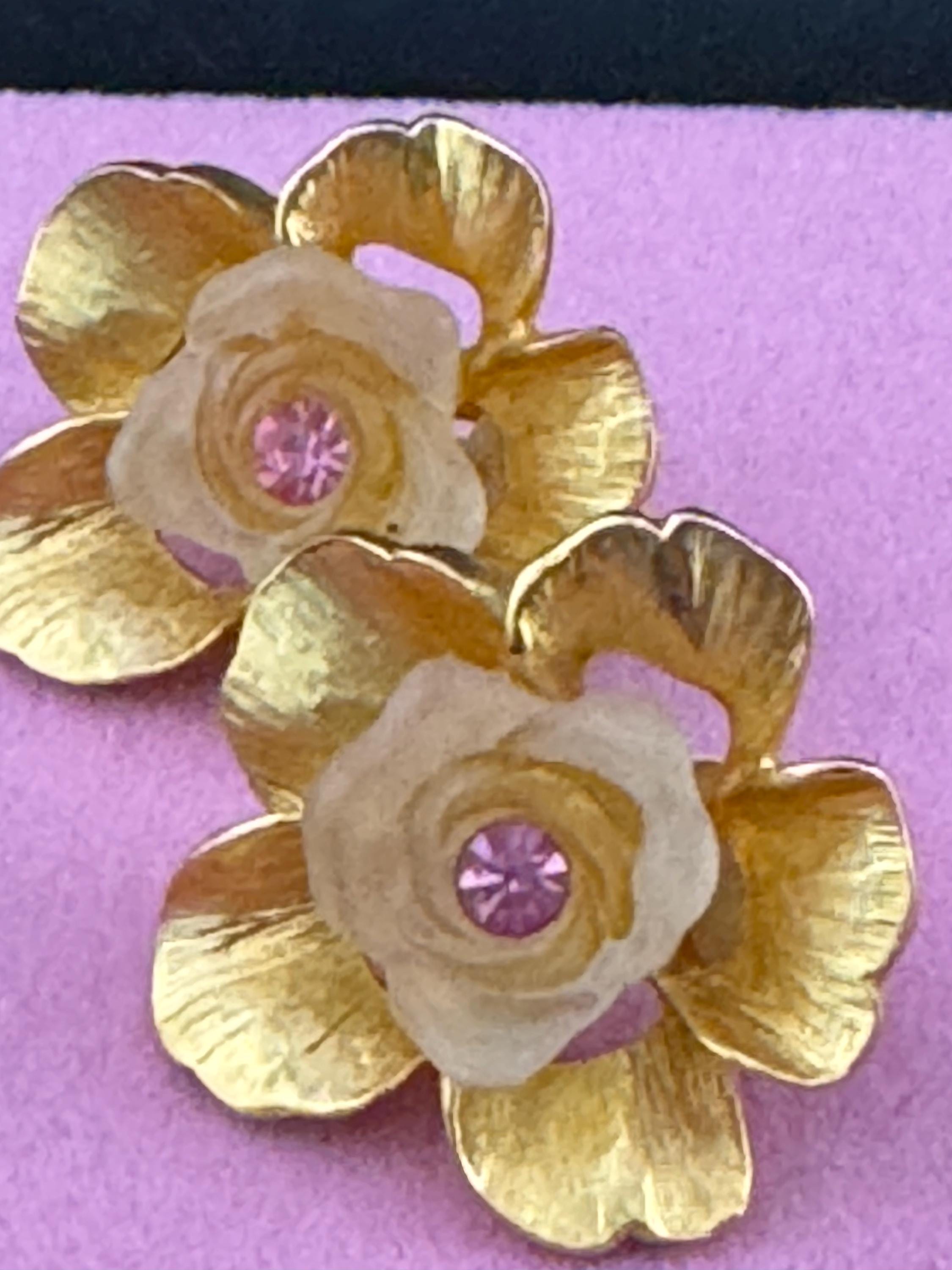 Vintage Ivana signed clip on earrings with gold large flowers Inset with opaque petals and pink rhinestone