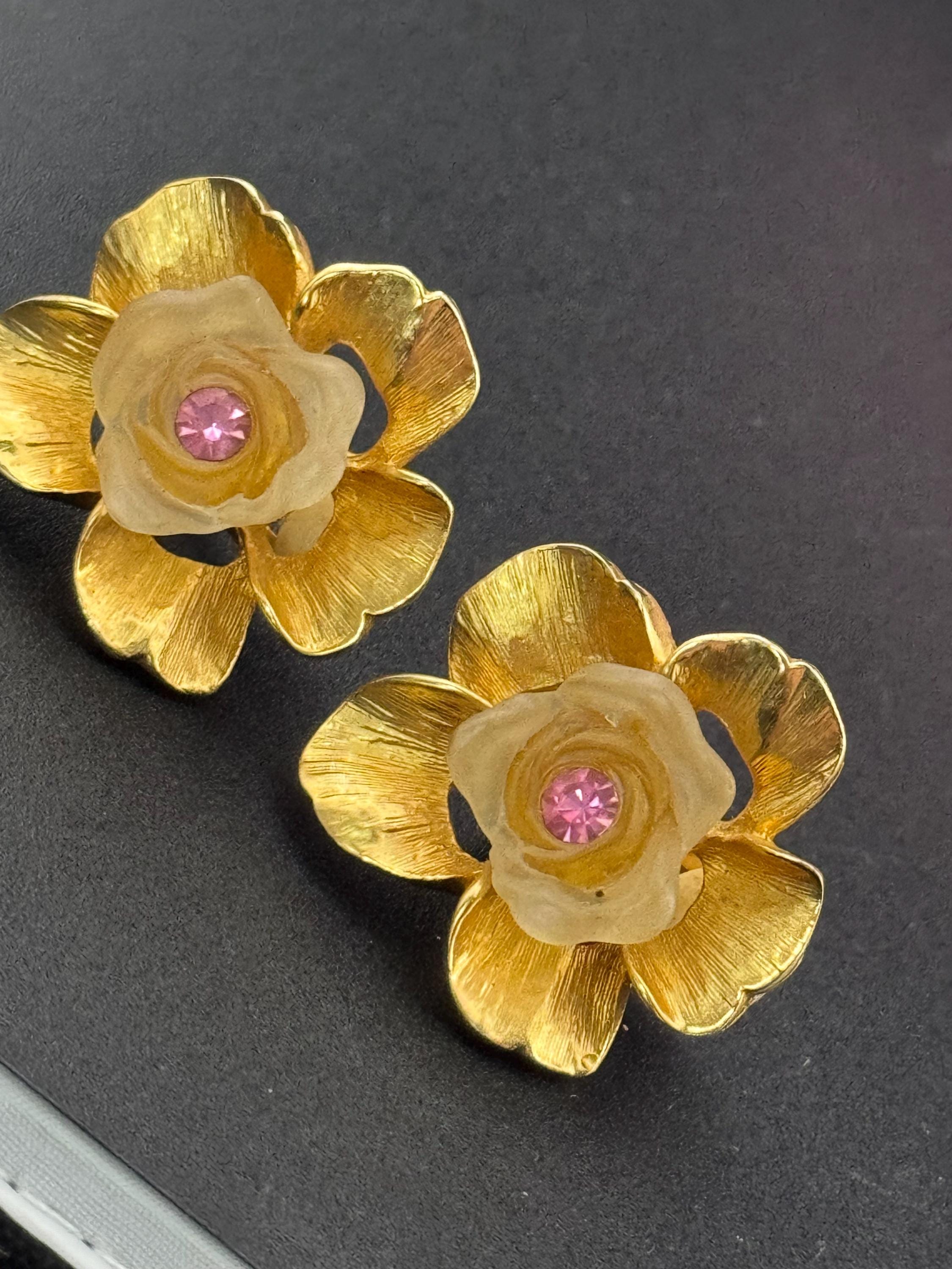 Vintage Ivana signed clip on earrings with gold large flowers Inset with opaque petals and pink rhinestone