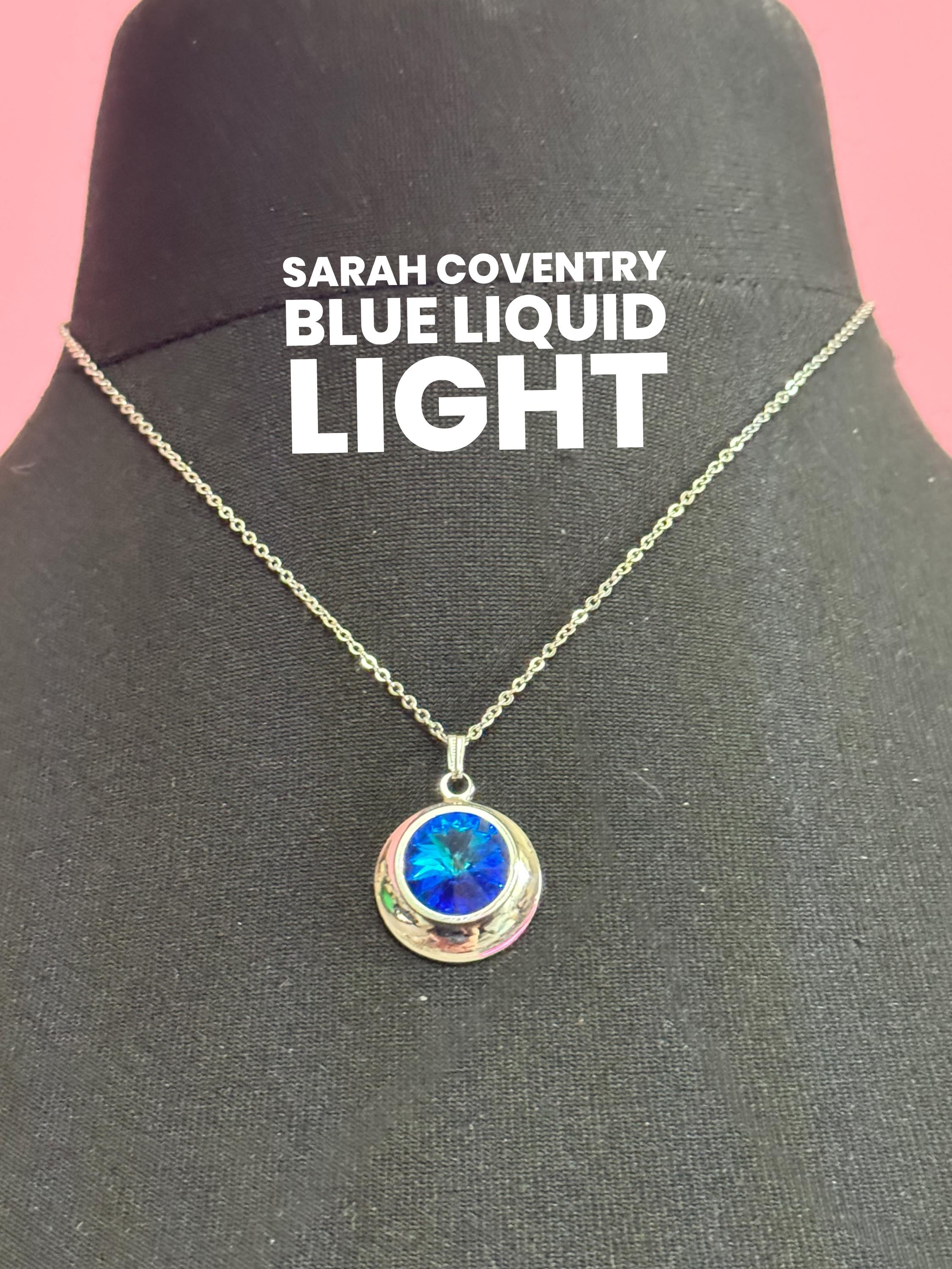 signed Sarah Coventry blue liquid light design silver tone blue Rivoli crystal 1970s pendant drop necklace, vintage designer