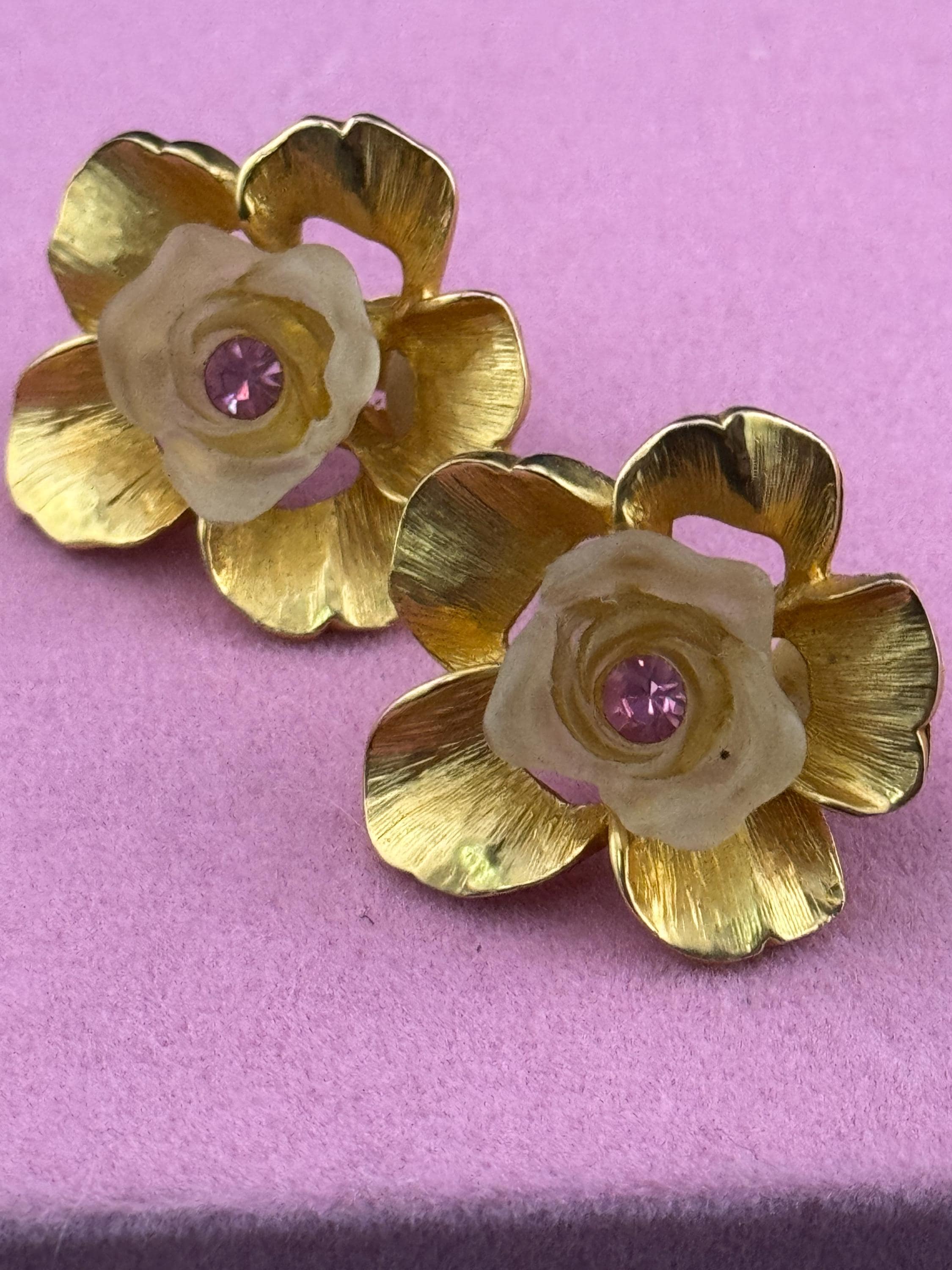 Vintage Ivana signed clip on earrings with gold large flowers Inset with opaque petals and pink rhinestone