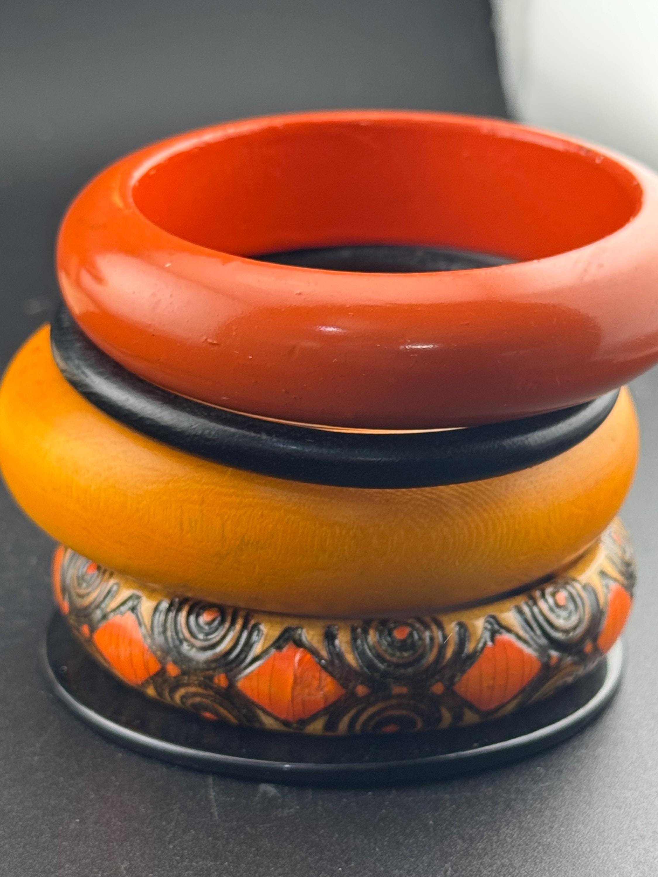 Vintage stack of black and red Chunky stylish plastic and wooden bangles retro bracelets