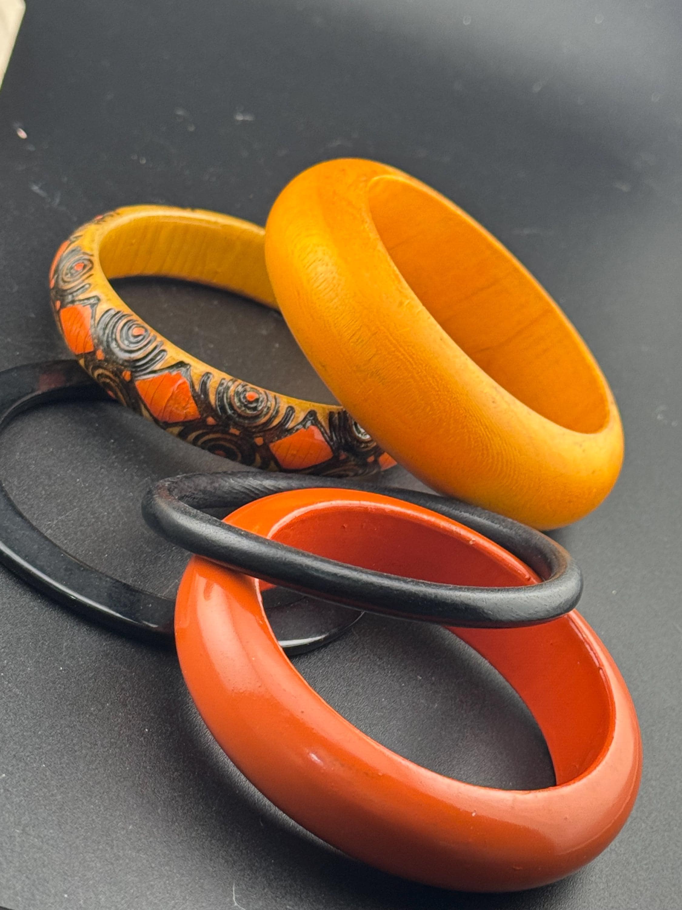 Vintage stack of black and red Chunky stylish plastic and wooden bangles retro bracelets