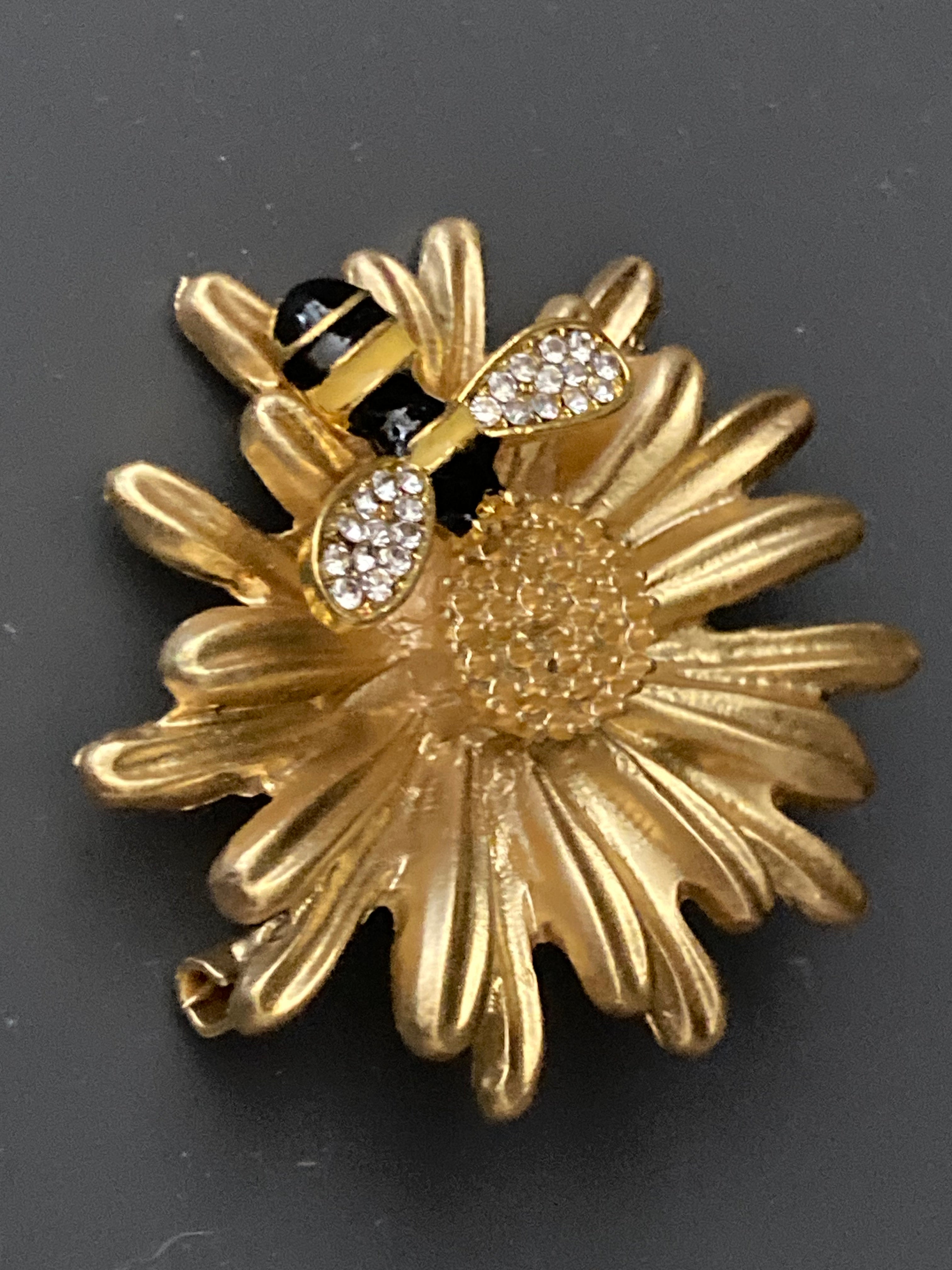 Gold bee collecting nectar flower brooch