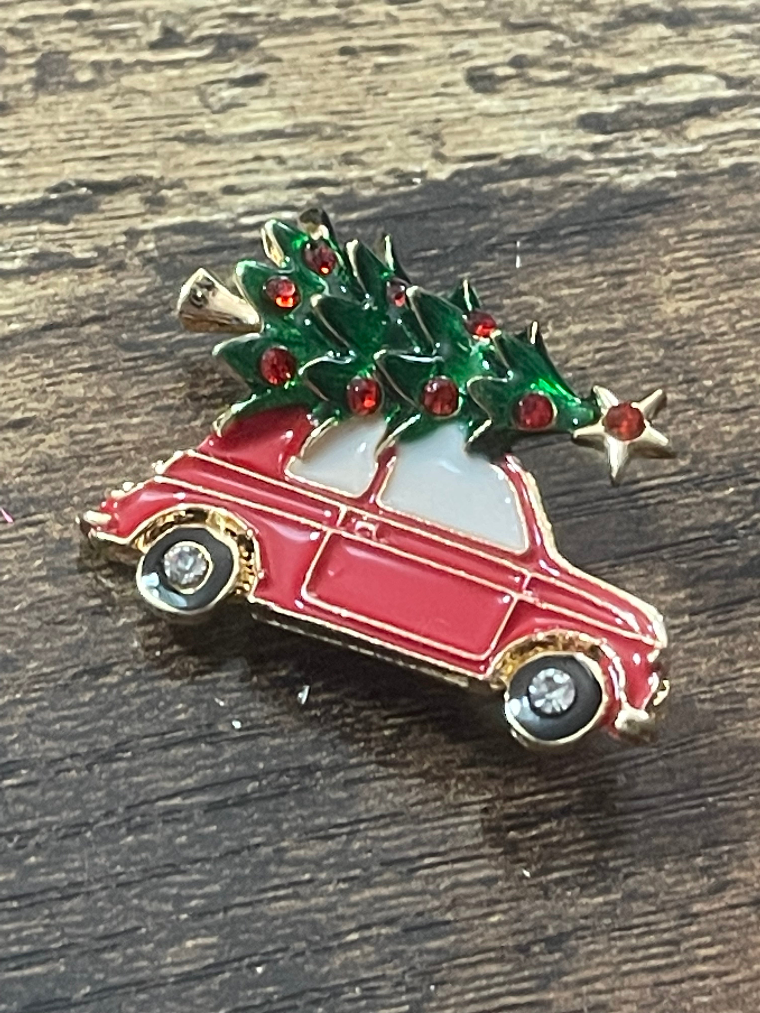 Driving home for Christmas tree and car brooch