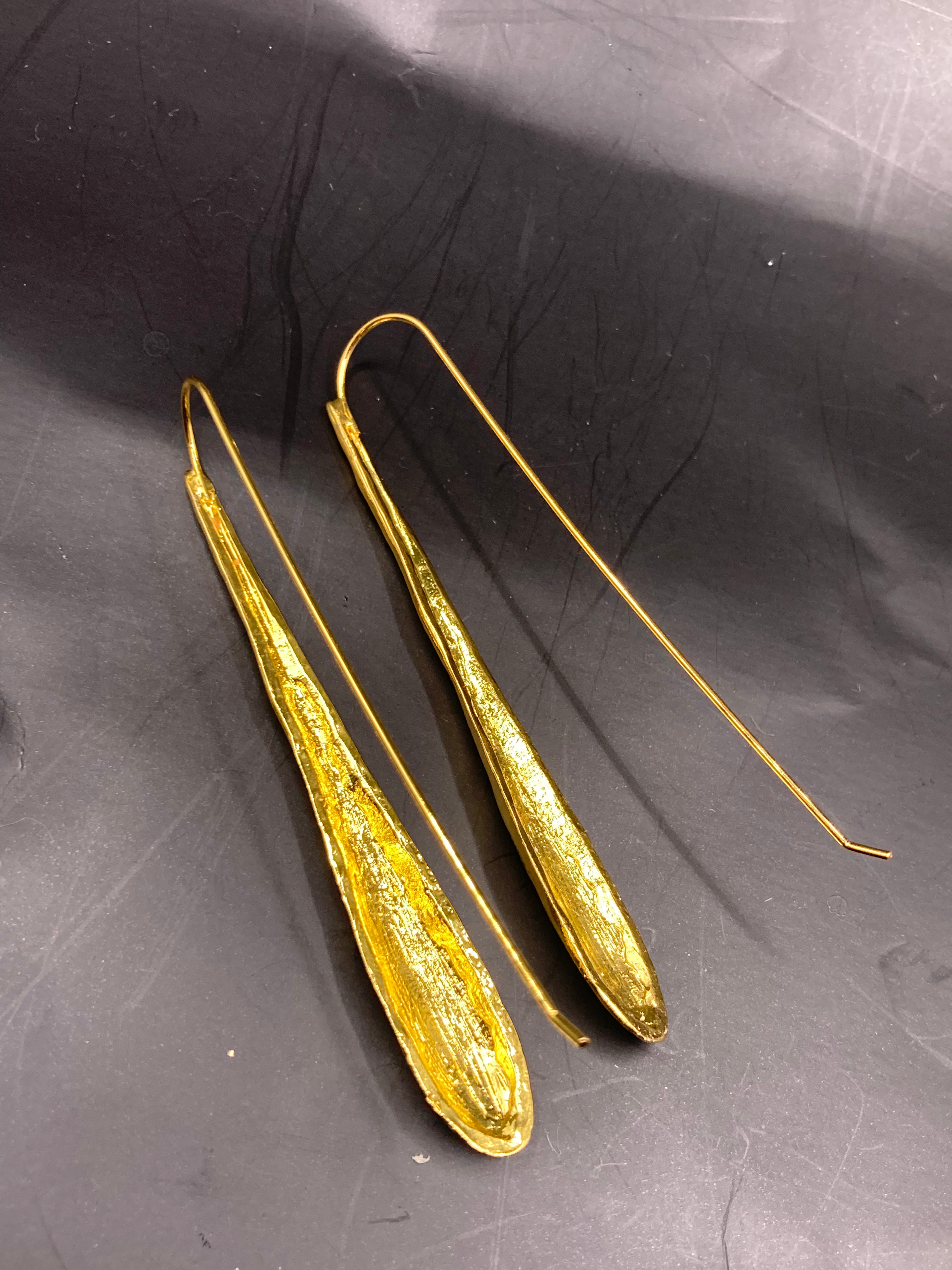 Long beaten metal drop earrings