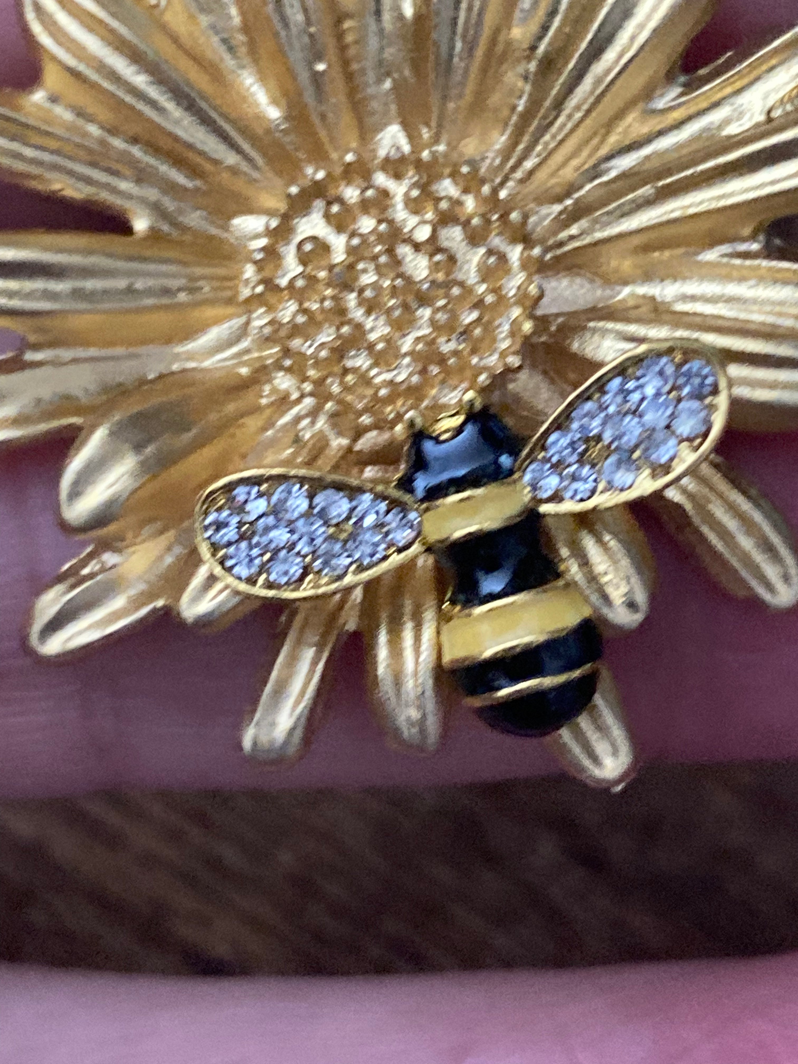 Gold bee collecting nectar flower brooch