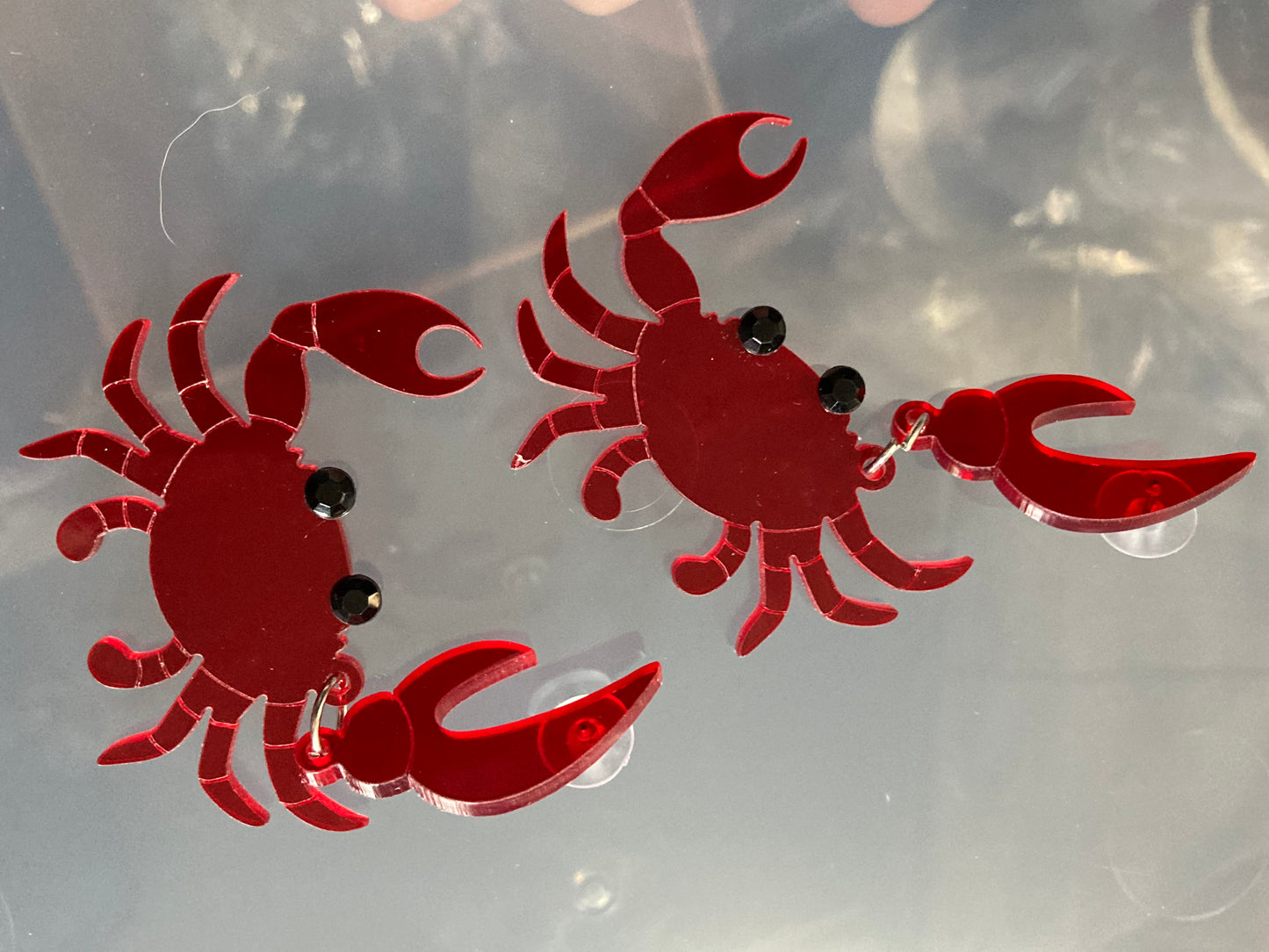 Large red acrylic crab earrings