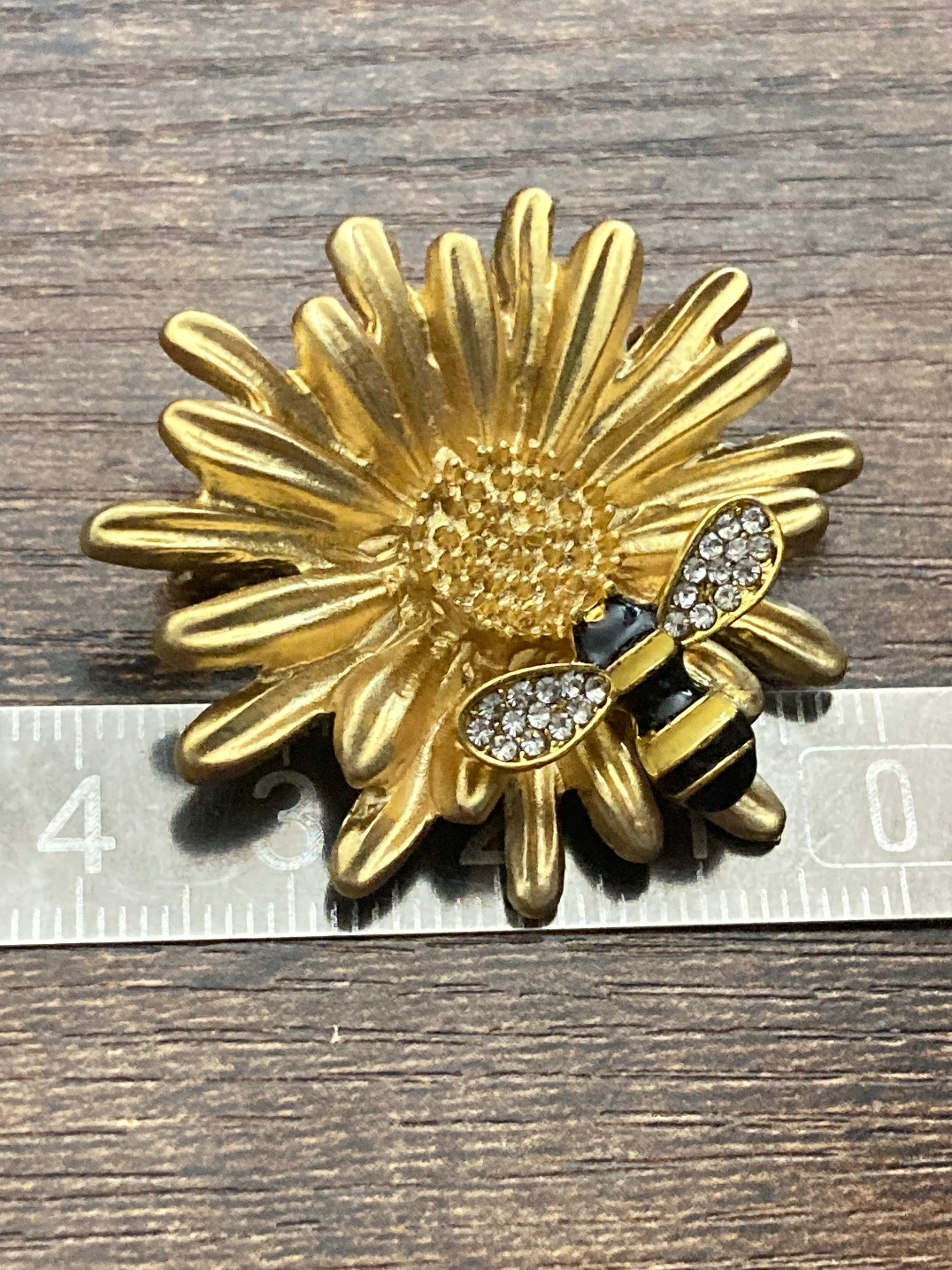 Gold bee collecting nectar flower brooch