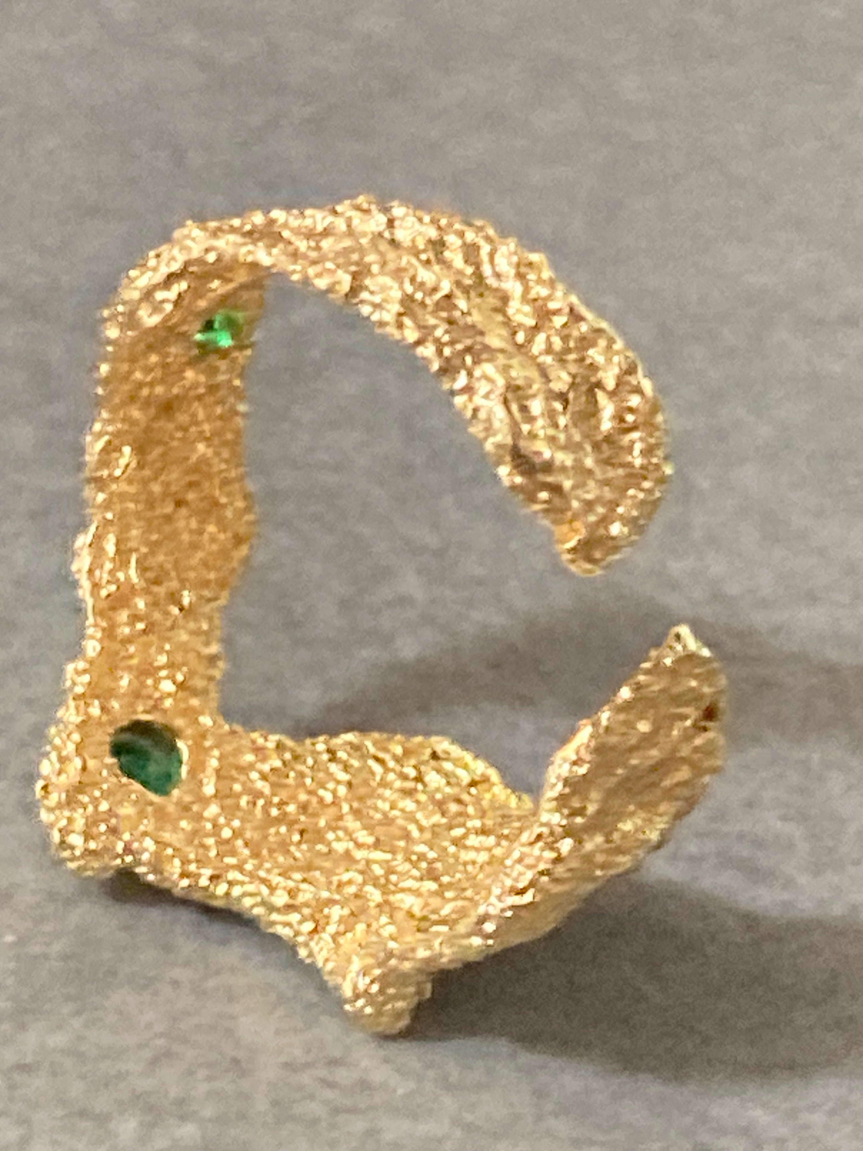 Modernist gold tone bark nugget dress ring with green stones