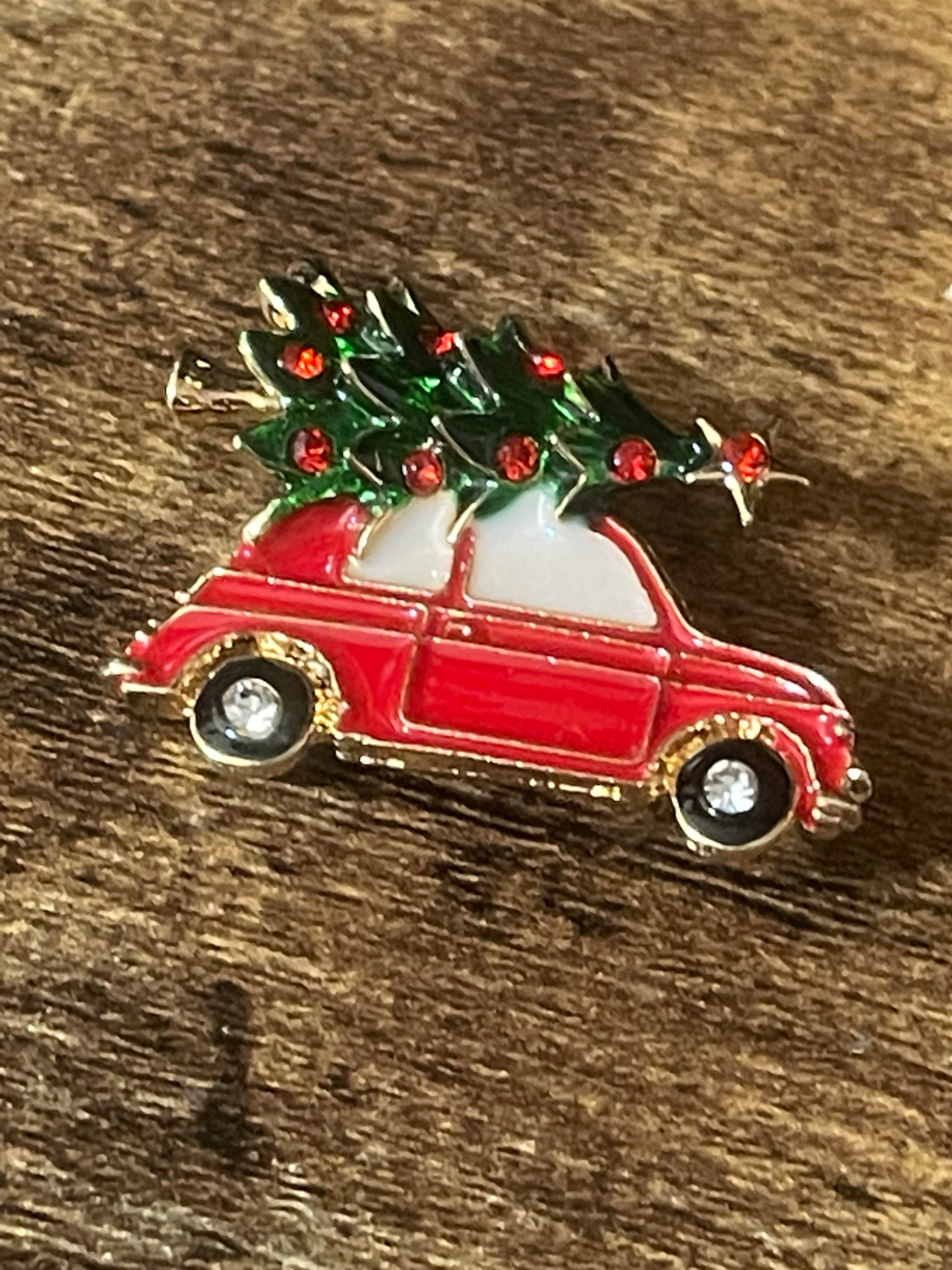 Driving home for Christmas tree and car brooch