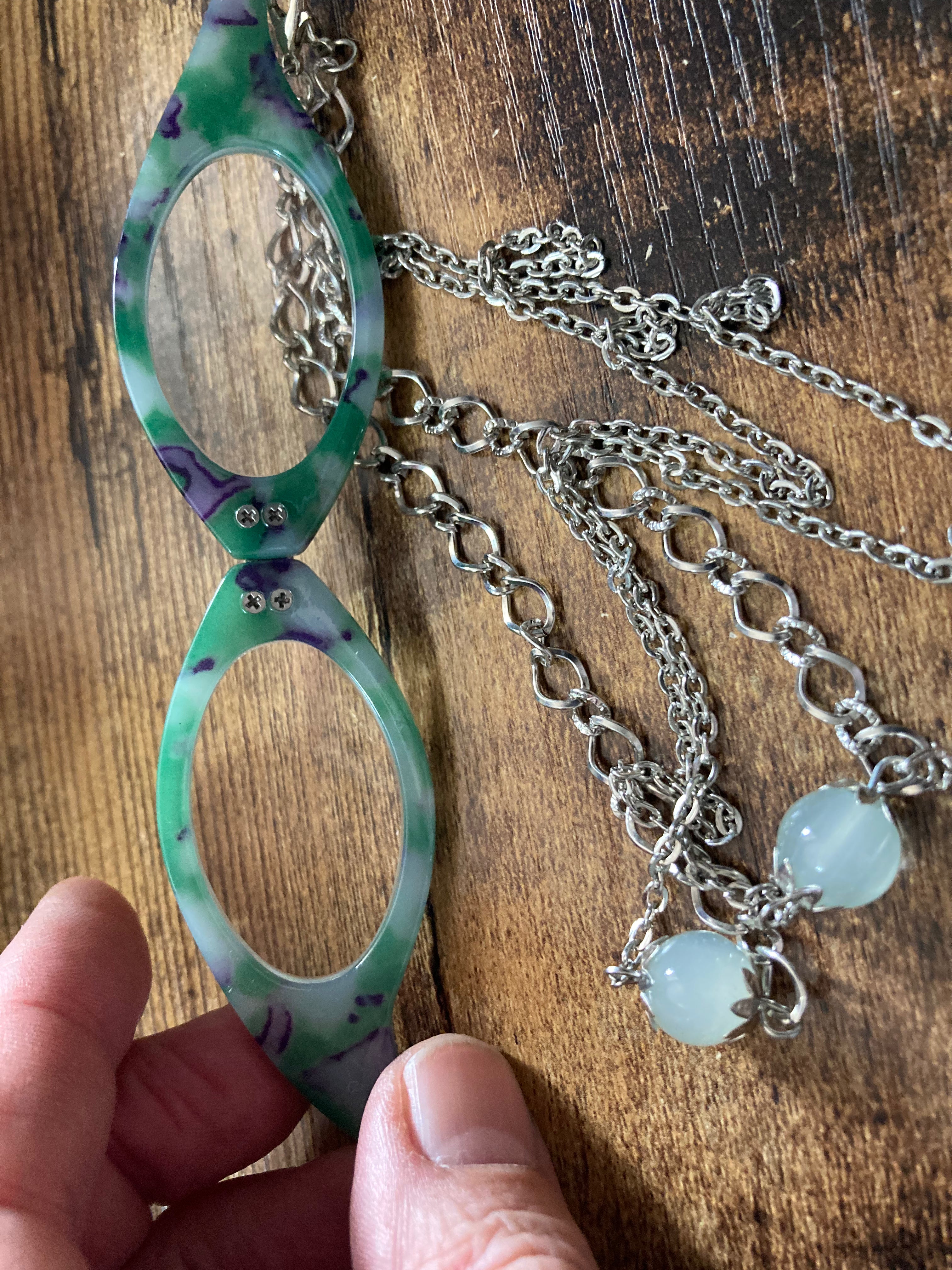 Folding green reading glasses on chain