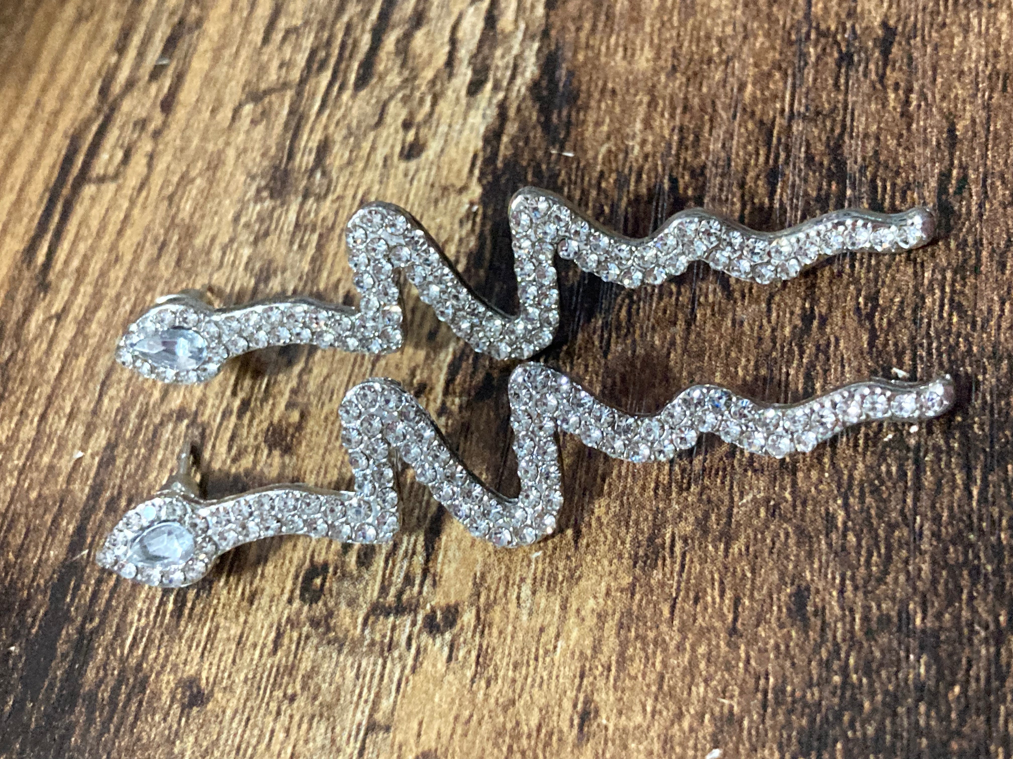 Long silver diamanté snake drop earrings