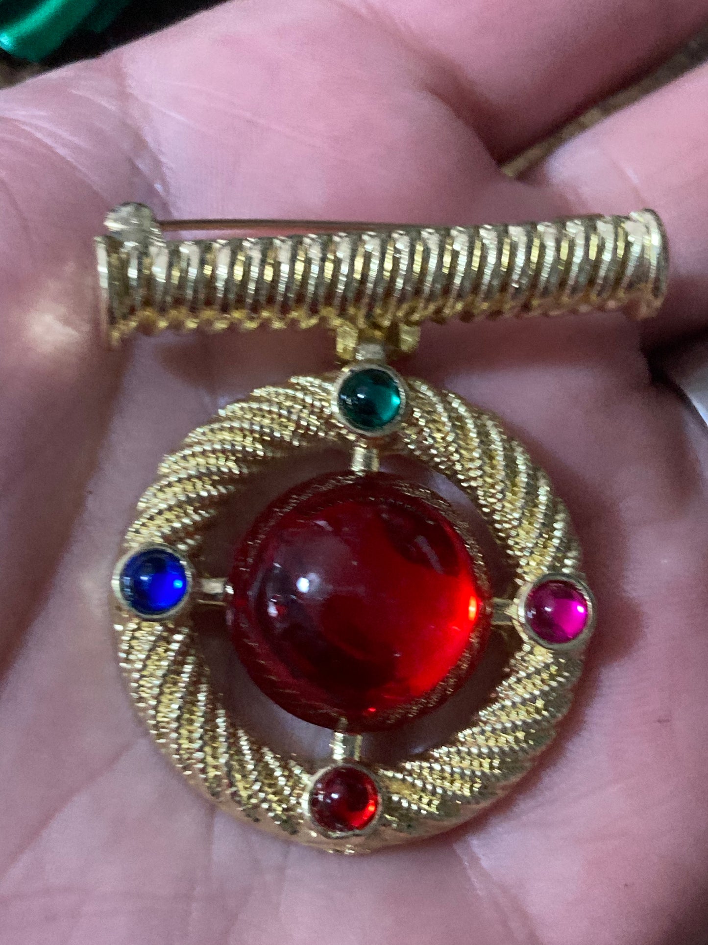 Gold medal ruby glass hanging brooch